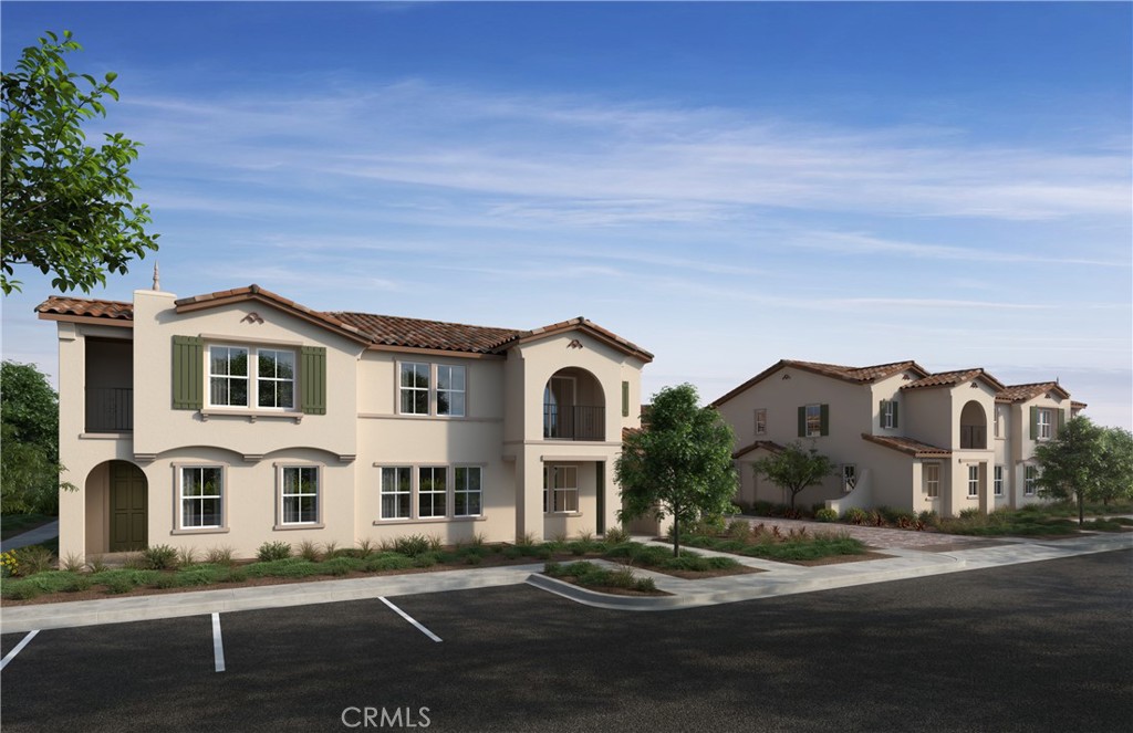 Belmont at Sunset Ranch is a beautiful resort-style community in the heart of Ontario Ranch. This floor plan offers 2,051 sq/ft of open floor plan spread across 2 floors. Take note of the expansive 9-ft ceilings bringing a nice vaulted feel at the first floor when you walk in. This open floor plan features the living, dining and kitchen downstairs. The stylish kitchen features white thermofoil cabinets, large kitchen island, walk in pantry, dining area, upgraded quartz counter tops and luxury vinyl plank flooring throughout the downstairs. Our homes offer brand-new Whirlpool® stainless steel appliances including a slide in gas stove, dishwasher and microwave. Additionally, the powder room and laundry room are downstairs. The upstairs leads right into an open loft the family can enjoy and two secondary bedrooms nearby. Those two bedrooms share a large hallway bathroom and has a tub/shower combination with double sinks. The spacious primary bedroom with a large walk-in closet, adjoining bath with cultured marble counter tops, dual sinks, an extended vanity with knee space and walk-in shower. There is also a private balcony from the primary bedroom for you to relax at after a long day at the office with the view of the Pool. Each home is built with uncompromising energy efficiency in mind such as a tankless water heater, smart thermostat, dual-pane low E glass windows and so much more to help ensure uninterrupted comfort all year long. All that is complemented by a solar energy system as well to maximize savings. Community amenities include two parks, pool and spa, dog park, and pickle ball courts. Easy access to the I-15, I-10, and 60 Freeways nearby. You are also close to shopping at Costco®, 99 Ranch Market, Cloverdale Marketplace and Eastvale Gateway. Ontario International Airport and Ontario Mills Mall are also just a short drive away. Belmont is conveniently located just 2.5 miles away from the brand-new Park View elementary school.
Photo is a rendering of the model. Solar is included