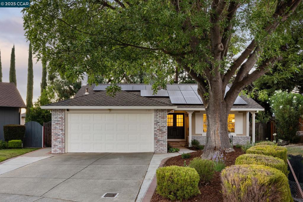 Tucked away on a quiet cul-de-sac near shops and a scenic park, this beautifully remodeled home offers comfort, style, and stunning Mt. Diablo views from the charming front porch with too many upgrades to count. Engineered hardwood flooring flows throughout this light filled home. The spacious family room features vaulted ceilings, a central brick fireplace, built-in bar, speakers, and plantation shutters. Enjoy cooking in the updated kitchen with granite counters, wood cabinetry, recessed lighting, with some premium KitchenAid stainless steel appliances. Dine at the breakfast bar or cozy nook with a sliding glass door for indoor outdoor connection. The primary bath is a true retreat with a barn door, frameless glass shower with multiple shower heads and modern finishes. The expansive backyard includes lush lawn, multiple decks and patio areas, vibrant gardens, and an outdoor TV for entertaining. Bonus features include a large laundry room (washer/dryer included), dual paned windows, mirrored closet doors, smart home thermostat, deadbolt, switches, and a solar system. Welcome home!