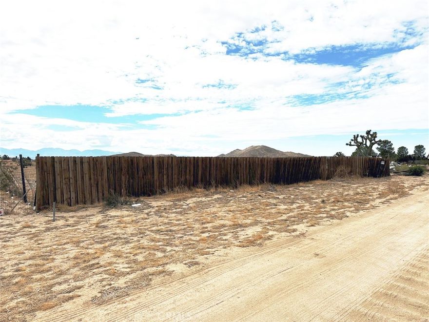 5 acres in a prime rural neighborhood lot with existing homes on both sides, offering the perfect balance of privacy and community. This ready-to-build property is conveniently close to pavement and comes equipped with a water meter already installed, electricity at the property line, and its own water well—saving you time and investment. Enjoy stunning mountain and desert views from your future home site in a peaceful setting that still keeps you close to essential access. Don’t miss this rare opportunity to build your dream home with utilities already in place!