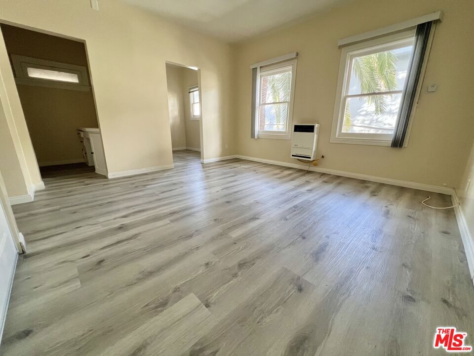 Step in to this beautifully renovated upstairs apartment, complete with luxury plank flooring, a spacious kitchen with stove/oven. Absolutely stunning bathroom with chic marble-style tiles. The massive closet with & the separate vanity area off of the bathroom provide the essentialsfor comfortable living. Situated in a bustling neighborhood, residents can enjoy easy access to nearby shops, restaurants, and entertainment options. This prime locationwon't last long - so schedule a viewing today and make this apartment your new home! No pets allowed.