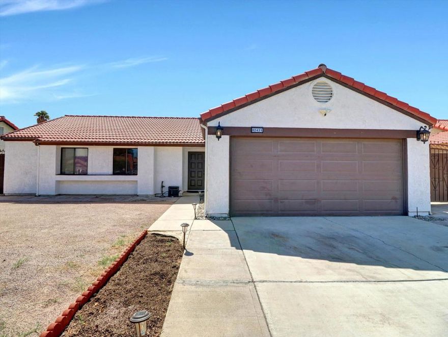 No Mello-Roos! If you're looking for a beautifully renovated home with a show-stopping kitchen, don't miss this opportunity! As soon as you walk in, you will be greeted with an abundance of natural light. For those cold, desert nights the spacious living room offers an elegant fireplace to keep you warm. The open floor plan makes it easy to access the fully upgraded kitchen, which boasts modern, stainless steel appliances, a kitchen island, marble backsplash, and sleek quartz countertops. The stylish flooring is the same throughout the home, which creates a sense of space and luxury. The primary bedroom has its own en suite. There is also an additional full bathroom in the hallway to accommodate the other two bedrooms or guests when entertaining.Enclosing a property can be a great expense. Fortunately, the entire property is already fenced and block-walled for you. With the back yard already level and the privacy from the block walls, you can easily create your very own desert oasis; perhaps even add a pool! With the fireplace-equipped living room and open kitchen having direct access to the front and back yards, indoor/outdoor entertaining is a dream. Whether you're hosting a family celebration or enjoying a relaxing evening to yourself, this home is sure to set the stage for many wonderful memories to come!