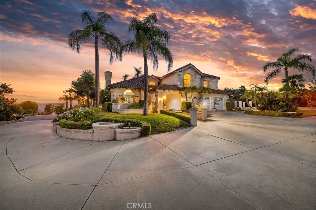 First Time on the Market in Walnut's Sunset Ridge Gated Community! Situated on a spacious, level lot at the top of the hill, this 3,245 square foot home boasts truly breathtaking panoramic views of the San Gabriel Valley. Built in 1988, this property is located in the peaceful gated community of Sunset Ridge. It is a rare combination of privacy, space, and opportunity!
With 5 generously sized bedrooms and 3 full bathrooms, including a desirable first-floor bedroom, this home is thoughtfully designed for comfort and flexibility. Make it yours! The 2nd floor's expansive primary suite features vaulted ceilings, a private en-suite bathroom, and stunning views. Enjoy formal living and dining rooms, 3 fireplaces, a beautiful entryway staircase, and front & back patios.
Additional highlights include a 3-car attached garage with direct access and ample parking for 6 or more cars. This 34,882 sq ft enormous lot provides exceptional potential for expansion!
Don’t miss the opportunity to own this one-of-a-kind property with unmatched views in a sought-after gated hillside community!