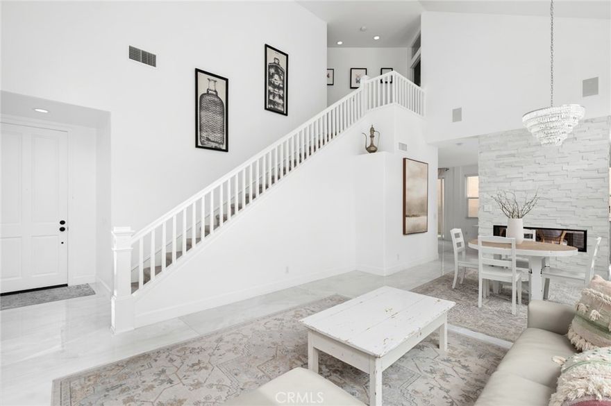 Tucked behind the gates of the coveted Sancerre community in Newport Coast, 18 Lessay showcases a beautifully renovated residence with rare backyard scale and timeless coastal charm. Thoughtfully updated throughout, the home features a newly remodeled kitchen, designer cabinetry, wide-plank flooring, stone countertops, and completely reimagined bathrooms—creating a fresh, elevated interior that lives effortlessly. Spanning nearly 2,000 square feet with 3 bedrooms and a spacious two-car garage, the home is defined by soaring ceilings, abundant natural light, and seamless indoor-outdoor flow. The oversized backyard—uncommon for the neighborhood—is a true highlight, complete with lush landscaping and a private in-ground spa, perfect for both quiet evenings and weekend entertaining. Ideally located just minutes from Fashion Island, Crystal Cove Promenade, world-class schools, and the best of Newport’s coastal lifestyle, this home offers the perfect blend of privacy, convenience, and modern design—all within one of the area’s most sought-after gated communities.