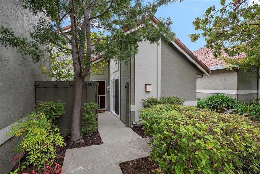 Welcome to this lovely 2-bedroom, 2-bathroom home, in the charming Croydon neighborhood of San Jose. This inviting home offers ample space, including a living room with soaring ceilings, updated chef's kitchen, bonus office with pull-down Murphy bed, attached 2-car garage, and new laminate flooring throughout. The kitchen features a gas cooktop and range, plentiful countertop space and cabinet storage, and a French-door refrigerator and freezer. Enjoy your meals in the dining area adjacent to the kitchen, illuminated by a large skylight. The elegant multi-purpose living room provides opportunities for entertainment and enjoyment. With central heat and AC, the home is ready for all seasons.  The primary bedroom suite features dual closets, updated vanity, and easy access to the home's private outdoor patio. Down the hall, the secondary bedroom is generously sized and well-lit. A full-size washer and dryer are conveniently located adjacent.  The well-maintained community features a large shared pool, clubhouse, and lounge. Don't miss the opportunity to make this San Jose gem your own!