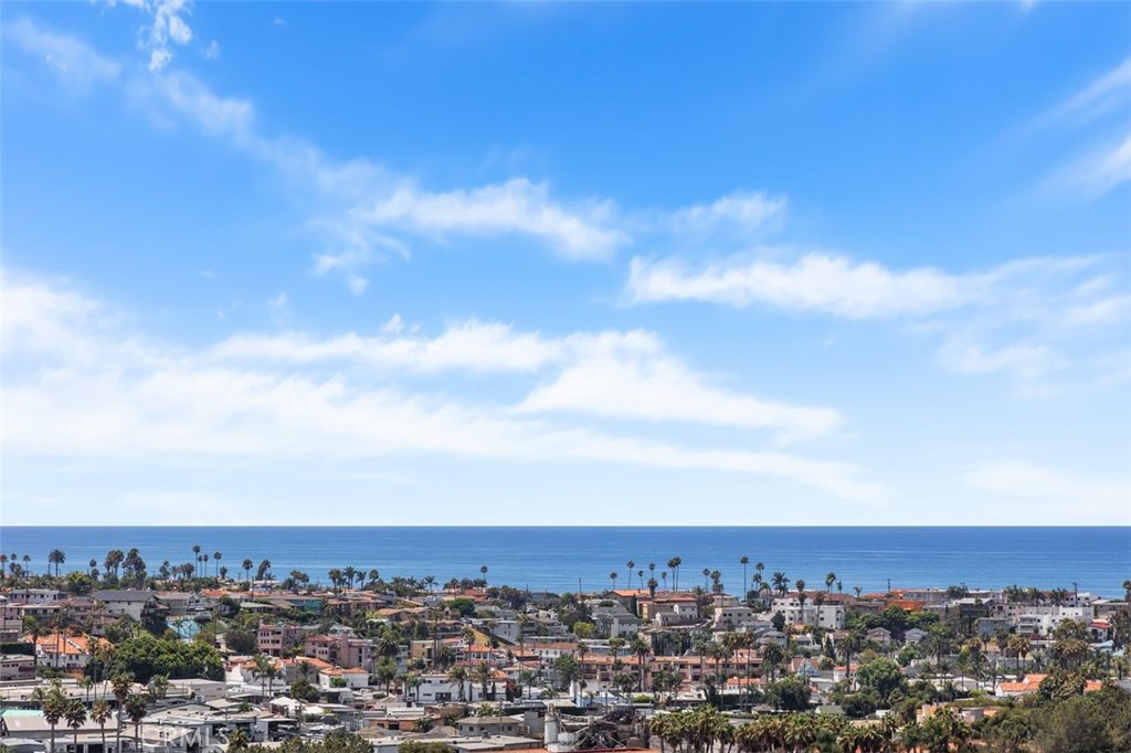 Welcome to your dream, coastal retreat in the ever popular city of San Clemente. Nestled up high, in the Faire Harbour complex, and angled to the South, this residence features outstanding, amazing, panoramic, forever ocean views that stretch from San Clemente and Dana Point to Catalina Island and city lights, as well. Thoughtfully remodeled with new custom soft close cabinets, appliances and fresh neutral colors. The Master bedroom features ocean views while the secondary bedroom has a garden window seat. The private balcony is perfect for morning coffee and breathtaking afternoon sunsets. Gentle breezes and ocean views create pure relaxation. Residents can enjoy the nearby community pool, spa and sport court. The two car garage is conveniently located near the home. This unit has a short flight of stairs leading to the front door and living is on one level. Elementary, Middle and High School are minutes away. Downtown San Clemente is known for local theatre, excellent restaurants, boutique shops and open air Farmers Markets. The area definitely speaks to a small town vibe. Known as the Spanish Village By The Sea, the area's heritage and architect are displayed everywhere. Its rich history promotes a healthy outdoor lifestyle, popular beaches and family friendly environment. The Beach Trail for hiking and biking offers stunning views and park areas. The City is commuter friendly with train lines, Metro and Amtrak, servicing from Los Angeles to San Diego. The year round climate and unlimited sunshine make for a truly treasured place to live. Up the Coast, is Dana Point, offering world class resorts, a newly renovated Dana Point Harbor complete with boat slips, yacht clubs, fishing, and Catalina Express. HOA dues include water. Street parking is available with a permit. Remodeled bathroom has double vanities for each bedroom and main bath features a skylight. New HVAC. There is currently an additional assessment for $46.23 per month for the upgraded Faire Harbour Community PEX Piping. Balance of assessment to paid at close of escrow by Seller. Seller, seller's agent and broker have not verified information in this MLS listing and have relied on public sources of data. Buyer and buyer's agent are strongly advised to perform their independent inspections and verify all information, including square footage, lot size, and property features to their satisfaction.