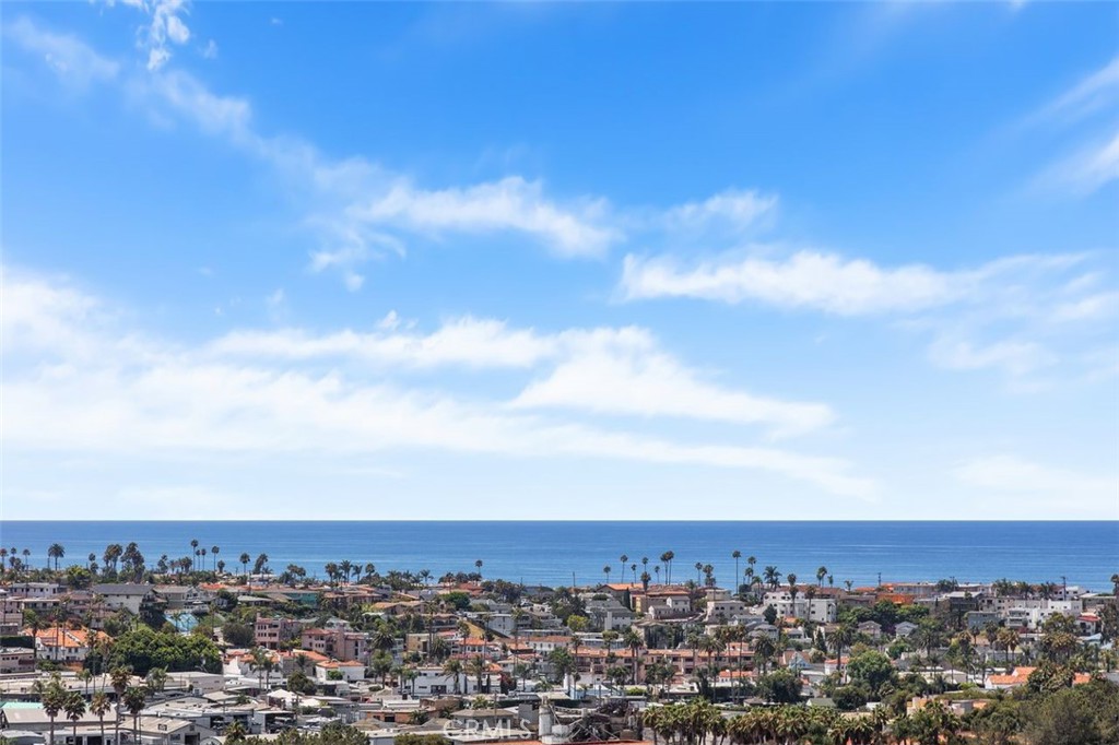 Welcome to your dream, coastal retreat in the ever popular city of San Clemente. Nestled up high, in the Faire Harbour complex, and angled to the South, this residence features outstanding, amazing, panoramic, forever ocean views that stretch from San Clemente and Dana Point to Catalina Island and city lights, as well. Thoughtfully remodeled with new custom soft close cabinets, appliances and fresh neutral colors. The Master bedroom features ocean views while the secondary bedroom has a garden window seat. The private balcony is perfect for morning coffee and breathtaking afternoon sunsets. Gentle breezes and ocean views create pure relaxation. Residents can enjoy the nearby community pool, spa and sport court. The two car garage is conveniently located near the home. This unit has a short flight of stairs leading to the front door and living is on one level. Elementary, Middle and High School are minutes away. Downtown San Clemente is known for local theatre, excellent restaurants, boutique shops and open air Farmers Markets. The area definitely speaks to a small town vibe. Known as the Spanish Village By The Sea, the area's heritage and architect are displayed everywhere. Its rich history promotes a healthy outdoor lifestyle, popular beaches and family friendly environment. The Beach Trail for hiking and biking offers stunning views and park areas. The City is commuter friendly with train lines, Metro and Amtrak, servicing from Los Angeles to San Diego. The year round climate and unlimited sunshine make for a truly treasured place to live. Up the Coast, is Dana Point, offering world class resorts, a newly renovated Dana Point Harbor complete with boat slips, yacht clubs, fishing, and Catalina Express. HOA dues include water. Street parking is available with a permit. Remodeled bathroom has double vanities for each bedroom and main bath features a skylight. New HVAC. There is currently an additional assessment for $46.23 per month for the upgraded Faire Harbour Community Re-Piping. Balance of assessment to paid at close of escrow by Seller. Seller, seller's agent and broker have not verified information in this MLS listing and have relied on public sources of data. Buyer and buyer's agent are strongly advised to perform their independent inspections and verify all information, including square footage, lot size, and property features to their satisfaction.