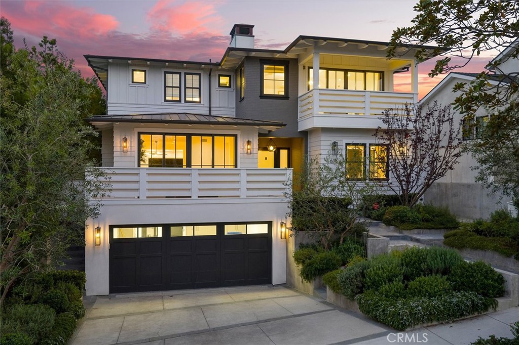 Welcome to 676 18th Street, a rare jewel nestled in the heart of Manhattan Beach’s esteemed American Martyrs neighborhood. This custom Coastal Plantation–style estate, that was thoughtfully reimagined by RJ Smith Construction, radiates modern opulence and coastal elegance, inviting a sophisticated beachside lifestyle. Upon entering, you're greeted by a dramatic interior flooded with natural light and impeccably designed for seamless flow. The chef’s kitchen anchors the open-concept living area, while the adjoining family room, formal living room, and dining spaces provide gracious spaces for both everyday living and grand entertaining. A versatile private office or bedroom on the main level offers flexibility for a home office or guest suite. The spectacular basement is an entertainer’s paradise complete with a one of a kind golf simulator, theater, wine cellar/bar, game room, and a guest suite/workout studio, Upstairs, discover four refined en suite bedrooms and a stunning master sanctuary perched to capture majestic views of distant snow-capped peaks. Luxury continues with spa-like baths, fireplaces, and an elevator serving every level for ultimate convenience. Step outdoors into the sun-drenched, south-facing backyard—a lush, grassy oasis perfect for relaxing or hosting al fresco gatherings under the gentle California sun. A three-car tuck under garage and sophisticated landscaping complete the picture. This spectacular residence redefines coastal elegance in Manhattan Beach.