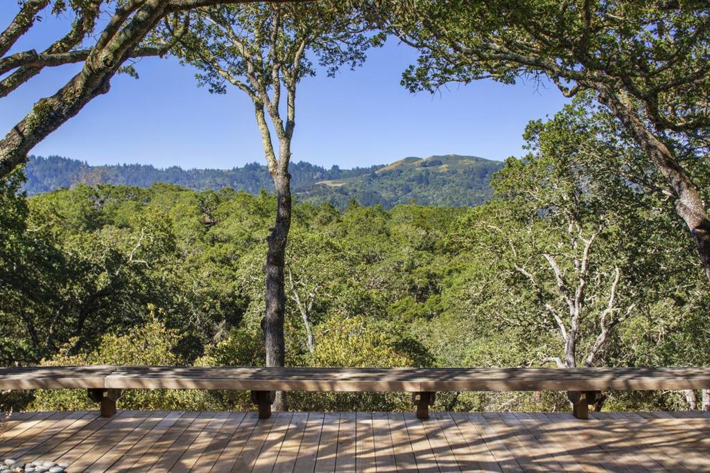 Views, views and more views. These four adjoining parcels with multiple breathtaking views of the Western Hills comprise one of the last large estates in the heart of Central Portola Valley. This approx 11.64-acre compound is a rare find in the Oak Hills/Westridge Corridor. Property has a 5 BR Mid-Century Modern home, 2 BR guesthouse, pool and two barns and the expansive surrounding land offers further development options. This private natural setting boasts a wide variety of mature trees which frame amazing views of Windy Hill from multiple locations. The property also features a large riding ring and a series of equestrian and hiking trails laid out to take advantage of the full expanse of the grounds. While surprisingly private in its central location, a host of amenities are nearby, including PV Town Center recreation facilities, the acclaimed PV schools, Windy Hill hiking trails, Ladera Shopping Center, Stanford University and 1-280 freeway access. 255GoldenHillsDrive.com