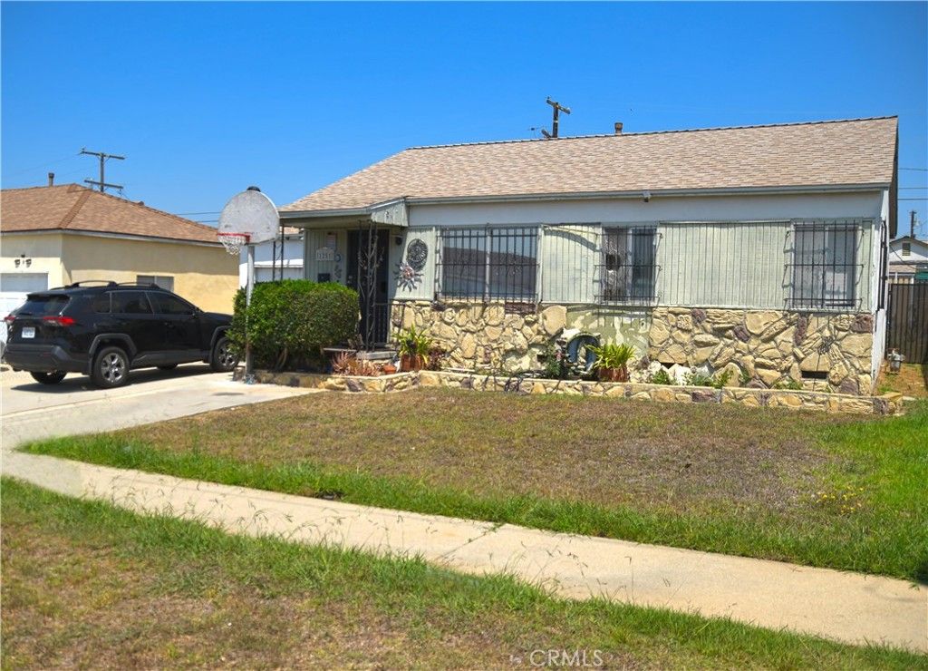 Photo of 1251 W 119th Street, Los Angeles, CA 90044 (MLS # RS25181384)