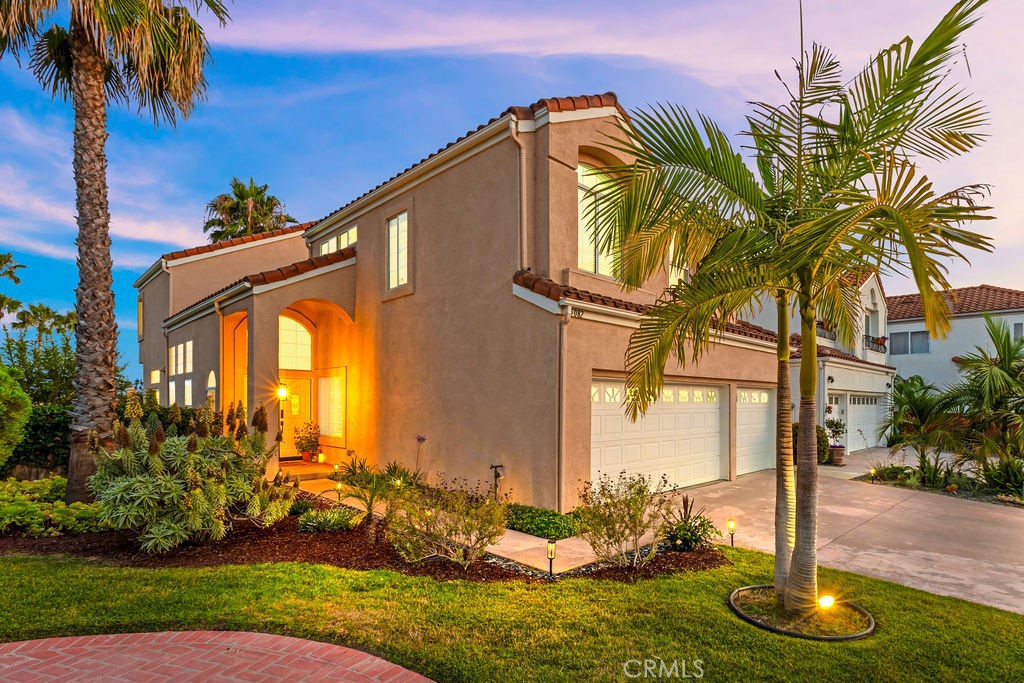 End-of-Cul-de-Sac Beauty with Expansive TROPHY LOT/SUNSET VIEWS/REPIPE/UPGRADED in Laguna Niguel! Tucked at the end of a peaceful cul-de-sac in coastal Vista Monte, largest of the tract, this spacious 5-bedroom (One downstairs), 3-bathroom detached single-family home sits on an oversized wrap-around lot—perfectly positioned to capture far-reaching vistas and enjoy sunset peek-a-boo ocean glimpses from the primary bedroom deck. The large lot is ready for a dream pool or custom outdoor living space. Step inside to soaring ceilings and a bright, airy layout with abundant natural light streaming through generously sized windows- Hunter Douglas Remote blinds added in downstairs family and kitchen areas too. The inviting formal entry flows seamlessly into the elegant living and dining rooms, while the remodeled kitchen features soft-close white cabinetry, sleek stainless-steel appliances, and a sunlit view of the backyard—ideal for entertaining and everyday living! Newer slider door opens to the view and a bright kitchen that opens to the cozy family room with fireplace, creating a warm and functional open concept space. Upgraded throughout with cohesive wood and newer luxury vinyl plank flooring—NO CARPET! Custom shutters downstairs and blinds added throughout for finished touch plus home also has been PEX repiped for peace of mind, Carrier HVAC, newer electrical switches, blinds throughout and includes Nest technology. The primary suite is a private retreat, complete with its own view deck, a luxurious remodeled bath featuring an elegant soaking tub, dual vanities, lighting, and stunning quartz countertops. All other bathrooms have had updated quartz counters and faucets. With 3 car garage and end of cul de sac views over Laguna Niguel, this home offer’s location, style, and space! VERY LOW HOA and No Mello Roos! HOA includes a tennis/sport court, park that captures 4th of July and a spacious grass picnic area! This community offers coastal closeness to Dana Point Harbor, Waldorf Hotel and the Salt Creek Trail (Across Marina Hills Dr) that you can bike or walk to Salt Creek Beach and Chapparosa Park! Don't miss out on owning this turnkey home!