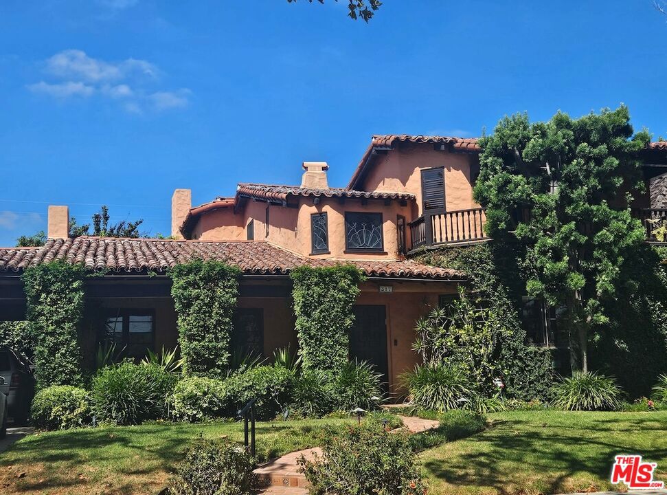 First time on the market in over 50 years is an exceptional 1927 Spanish Revival home on world famous Rodeo Drive. Located on a beautiful tree lined street set behind gates are 5 bedrooms (4 upstairs and one bedroom and bath down). Features are a beautifully wood beamed living room with French doors that open to the yard, as well as a large family room that opens to the lushly landscaped private yard with a pool, bathroom, changing room, and additionally an outdoor bar and entertaining area. The primary bedroom is en-suite with 3 additional bedrooms upstairs. A generous kitchen has a separate breakfast area, a laundry room and more. Just minutes from world class shopping, restaurants and top rated schools. First showing on Tuesday.