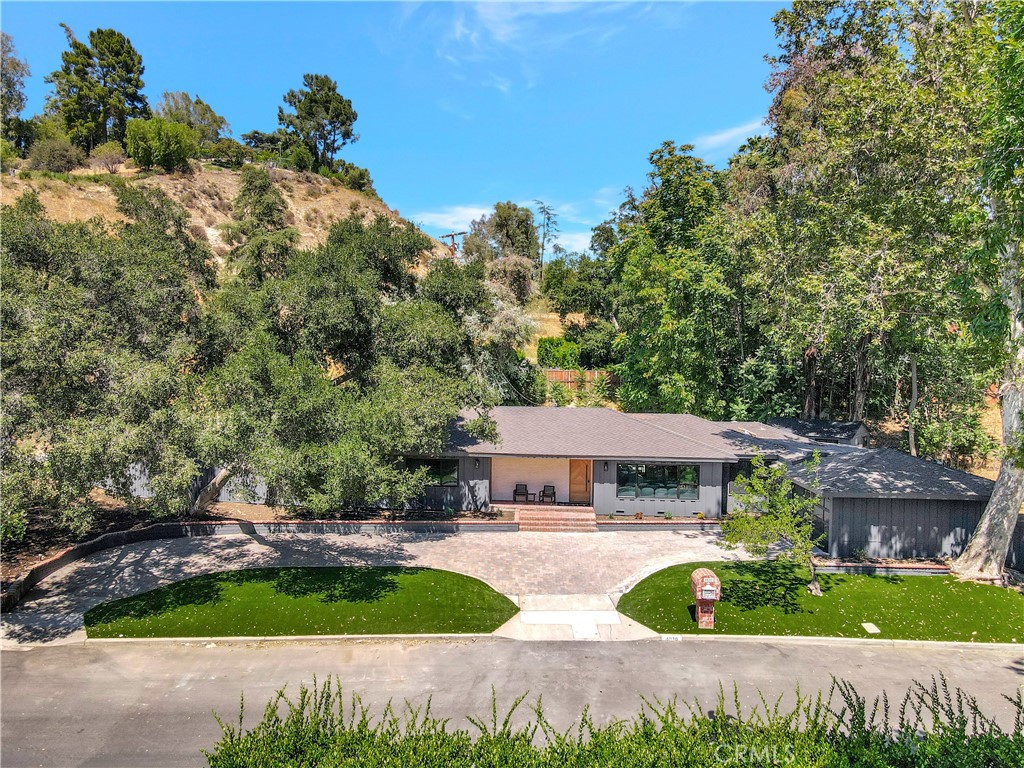 Welcome to this absolutely breathtaking, fully remodeled treasure tucked away on a private cul-de-sac just south of Ventura Boulevard in Tarzana! This spacious four-bedroom, four-bathroom home is flooded with natural light and designed with perfection in mind, offering everything you need and more. Step inside to discover an open floor plan that truly has it all. Each bedroom boasts its own full bathroom, ensuring plenty of privacy, while ample storage adds to the convenience. You'll love the super private backyard, featuring a delightful oasis with a sparkling pool, barbecue area, and an extra outdoor room that’s perfect as a gym or home office. The two-car garage and circular driveway provide plenty of parking for you and your guests. Plus, this fantastic location is just minutes away from shopping, freeways, and great schools!