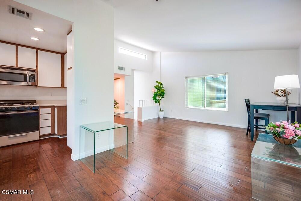 Welcome to highly desirable Meadowood Village! This beautifully updated condo is move-in ready and filled with charm. Freshly painted with newer wood/wood-style flooring, brand-new dishwasher, bathroom sinks/faucets and toilets, this home offers effortless comfort and style. Boasting 2 spacious bedrooms and 2 full bathrooms, each with dual tub/shower combos, there's plenty of room to relax and unwind. The oversized living room features a cozy fireplace and opens to a private balcony with new Sliding glass doors, with stunning mountain views, perfect for enjoying your morning coffee. The kitchen includes a generous dining area, ideal for entertaining. A 2-car attached garage with laundry area adds convenience, and the washer is included!Meadowood Village offers an unbeatable lifestyle with resort-style amenities: 2 gated pools and spas, tennis and basketball courts, large greenbelt areas, a children's playground, and scenic walking trails with panoramic mountain views. Perfect for those seeking an active and connected community. HOA dues cover water, trash, sewer and master insurance for added peace of mind.Additional bonuses: wall-mounted TV above Fireplace in the living room stays, and a few untouched areas allow the next owner to customize and make it truly their own. Don't miss this opportunity to own a slice of Rancho Cucamonga living!