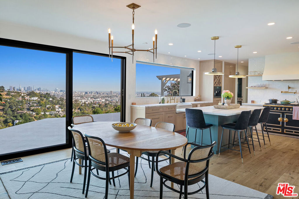 Welcome to your sanctuary with complete avant-garde sophistication. Originally built in 1937, but elegantly overhauled in 2022, this stunning French Contemporary offers 200 degree breathtaking views of both vibrant Downtown Los Angeles and the iconic Griffith Observatory. With a meticulously redone floor plan, boasting three tastefully designed bedrooms and two and a half luxurious bathrooms, all are thoughtfully positioned to showcase the awe-inspiring cityscape from every angle. From the carefully chosen furnishings to the well thought out amenities, every detail reflects the owner's discerning eye for design. With a harmonious blend of modern aesthetics with French influences, the open kitchen is the the piece de resistance with a stunning La Cornue range. Unwind in style on the outdoor patio, an oasis of relaxation elevated to new heights and take in the twilight views as you decompress or entertain guests with an additional outdoor kitchen. The expansive open space is an invitation to savor the dynamic cityscape, transforming your evenings into truly unforgettable experiences. This is not just a home; it's an expression of edgy sophistication. Ideally located in Beachwood Canyon and close to the trails of the Hollywood reservoir and Beachwood Cafe, you'll have privacy you need with the convenience of city life close by.