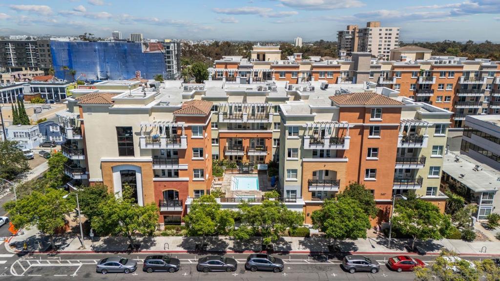 Discover urban living at its finest in the heart of Hillcrest’s coveted Atlas building on the quieter corner of Pennsylvania and 4th with this bright and spacious 2-bedroom, 2-bath condo featuring a rare private ground floor entrance. Located in one of San Diego’s most vibrant neighborhoods, this unit offers modern comfort, stylish updates, and access to a host of community amenities. The uniqueness of having your own external private entry and no one above you cannot be overstated for quality of life in a condo setting! ? Unit Features: 2 bedrooms, 2 full bathrooms Freshly painted with clean wood flooring Spacious kitchen with granite countertops and gas stove In-unit washer and dryer for convenience Two dedicated parking spots & storage included Exterior private access for single family home feeling ?? Community Amenities: Resort-style pool and spa Fitness center Rentable community room for gatherings BBQ areas perfect for entertaining Private storage units Ample guest parking 2 pets up to 50#s allowed EV Charging Enjoy easy access to Hillcrest’s shops, restaurants, nightlife, and public transit, all while living in a secure, amenity-rich building. Imagine a home where you can park your car on Friday night and not need it again until Monday morning. That’s life at 3687 4th Ave Unit 101, in the heart of Hillcrest’s highly coveted Atlas building. This is not just a condo, it’s your launchpad for a vibrant, walkable lifestyle that perfectly balances energy and serenity. On the quiet side of the complex, your private ground floor entrance means you can slip in and out with ease, without hallways or elevators. Inside, fresh paint and warm wood flooring give the space a polished, inviting feel. The spacious kitchen, complete with granite countertops, stainless appliances, and a gas stove, is ready for everything from lazy weekend brunch to impromptu dinner parties. With two bedrooms and two full baths, it’s a comfortable fit for a professional who wants a dedicated office or for two roommates looking to share expenses without sacrificing privacy: even better, the building is VA approved, making it an ideal option for those using VA financing and wanting to househack their way to wealth. Step outside and the best of Hillcrest unfolds at your feet. Go just a few blocks to legendary Hash House a Go Go for oversized, farm-fresh breakfasts that fuel you for the day ahead. Grab a slice at Sister’s Pizza, a local favorite that feels like an East Coast transplant in the heart of San Diego. On Sundays, the Hillcrest Farmers Market is your neighborhood grocery store: wander through stalls of fresh produce, local cheeses, baked goods, and colorful flowers, chatting with vendors who know you by name. When it’s time to recharge, your home at Atlas offers all the amenities of resort living without the feel of apartment life. The sparkling pool and spa are perfect for a midday dip or sunset soak. Stay active in the well-equipped fitness center or host friends in the rentable community room for birthdays, game nights, or wine tastings. Fire up the BBQs for an evening cookout and let the day wind down. With private storage, two dedicated parking spots, and plenty of guest parking, every convenience is at your fingertips. And here’s the best part: even with all these shared amenities, Atlas never feels crowded. The building is thoughtfully designed to offer privacy and calmL an urban sanctuary in one of San Diego’s most exciting neighborhoods. Your unit’s location on the quiet side of the complex ensures peaceful nights and a relaxed environment, so you can enjoy the energy of the city without the noise. Whether you’re a professional who wants to live steps from the city’s dining and entertainment, needing a single level home, someone looking for a lock-and-leave lifestyle, or friends exploring a house-hacking arrangement, this condo offers flexibility, comfort, and unmatched access to everything that makes Hillcrest special. From mor...