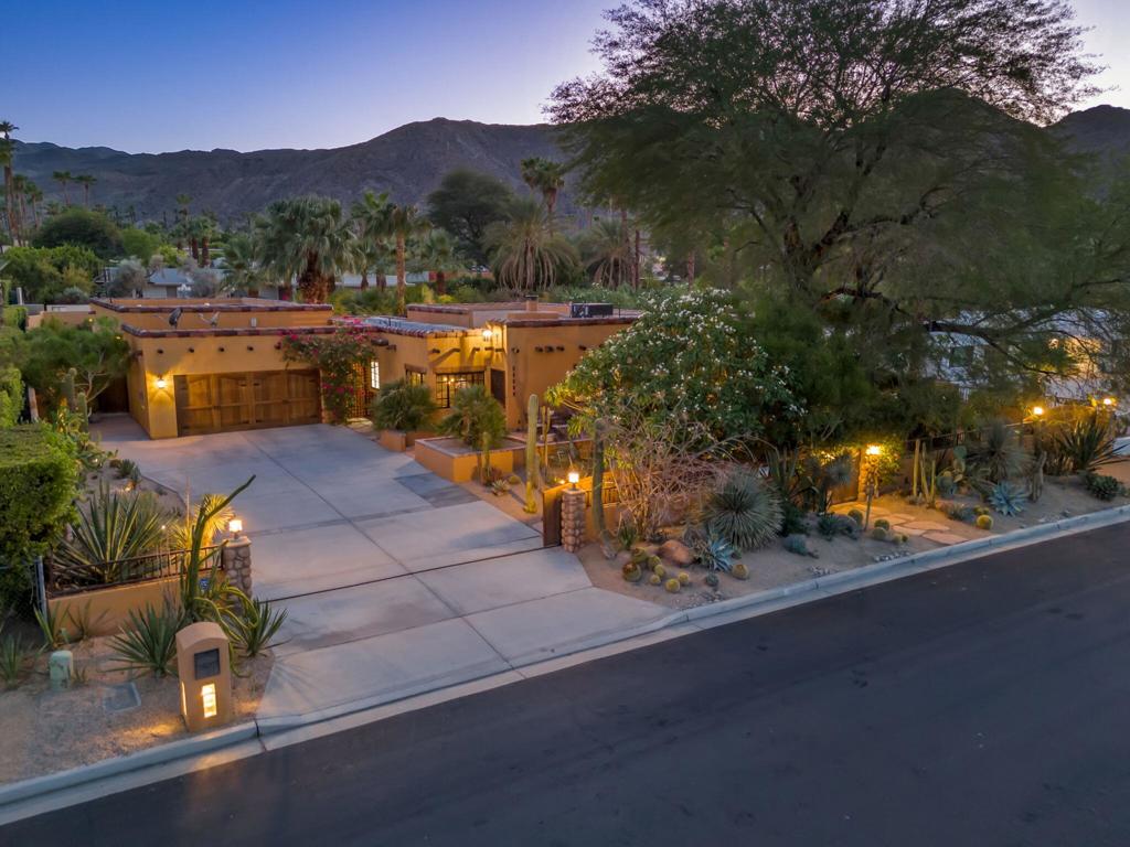 Presenting a 2005 version of a modern Mexican hacienda in the heart of Magnesia Falls Cove! Gated and totally private, this VERY unique home enjoys pueblo and Spanish Colonial influences surrounded by a virtual botanical garden featuring citrus, fig and palm trees, plumeria, and dramatic varieties of yucca and cactus. 4 beds and 5 baths with room for more if needed! Separate enchanting casita PLUS a 6 CAR GARAGE, PLUS bonus room, gym or office, large laundry and bath. The custom and unique pool & spa will convince you that you're on an exotic vacation. MANY recent upgrades and improvements (see attached document) complement the rustic warmth and old-world charm of natural wood, terra cotta and Talavera tiles, vigas, arched doorways and wooden beams. Fountains, water features, a poolside fireplace and outdoor shower just to make sure you relax, indulge and extend your stay! THIS is a most unusual and luxurious desert retreat.