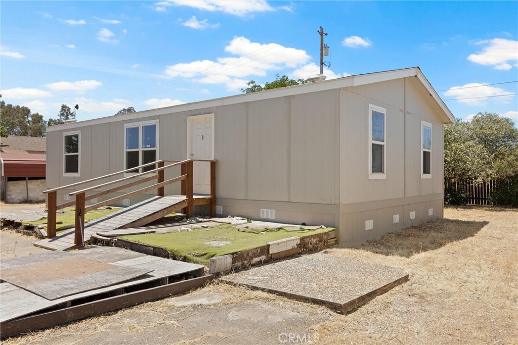 Discover the boundless potential at 5580 Wilbur Road! This charming manufactured home is really an invitation to a lifestyle of tranquility, recreation, and convenience, all on a spacious ¾-acre lot. With over a hundred acres of California-owned land directly backing your property, you’ll relish the unparalleled privacy and breathtaking views of the rolling foothills each day.
The best part? Enjoying the serenity of the countryside doesn’t mean you have to sacrifice accessibility. All within a 5 minute drive, you’ll find the afterbay, the table mountain golf course, and a shooting range, perfect for outdoor enthusiasts. On top of that, despite its idyllic, private setting, you're never far from modern conveniences; less than ten minutes brings you to Walmart and town amenities, perfectly balancing country living with daily necessities.
The property itself is thoughtfully equipped for your comfort, featuring a detached garage, multiple sheds for ample storage, an unfinished basement, and a semi-enclosed carport. Recent upgrades include a brand-new septic tank installed last year and essential work completed on the well.
Although there is work and TLC needed, essentially, 5580 Wilbur Road offers the best of both worlds: a private and relaxing countryside retreat, all while being less than 10 minutes from town and its essential amenities.