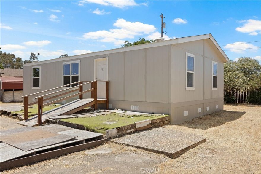 Discover the boundless potential at 5580 Wilbur Road! This charming manufactured home is really an invitation to a lifestyle of tranquility, recreation, and convenience, all on a spacious ¾-acre lot. With over a hundred acres of California-owned land directly backing your property, you’ll relish the unparalleled privacy and  breathtaking views of the rolling foothills each day. 

The best part? Enjoying the serenity of the countryside doesn’t mean you have to sacrifice accessibility. All within a 5 minute drive, you’ll find the afterbay,  the table mountain golf course, and a shooting range, perfect for outdoor enthusiasts. On top of that, despite its idyllic, private setting, you're never far from modern conveniences; less than ten minutes brings you to Walmart and town amenities, perfectly balancing country living with daily necessities. 

The property itself is thoughtfully equipped for your comfort, featuring a detached garage, multiple sheds for ample storage, an unfinished basement, and a semi-enclosed carport. Recent upgrades include a brand-new septic tank installed last year and essential work completed on the well. 

Although there is work and TLC needed, essentially, 5580 Wilbur Road offers the best of both worlds: a private and relaxing countryside retreat, all while being less than 10 minutes from town and its essential amenities.