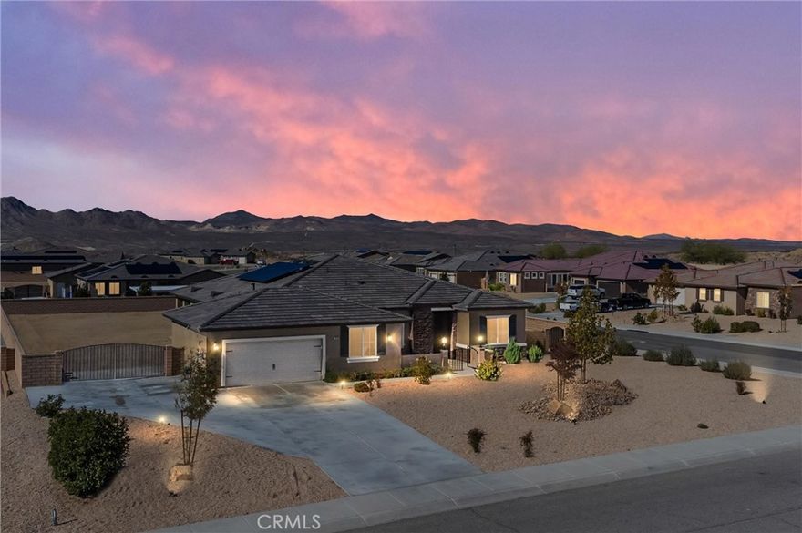Resort Living at its' finest! This stunning home is located in the popular Vista Del Sol Estates "gated" community. Close to shopping, restaurants, freeway access and entertainment.  Welcome to your new High Desert Oasis, this light and bright open floor plan offers a grand living area with gourmet kitchen, four generous sized bedrooms, three baths and an office.  Enjoy a spacious open indoor/outdoor space with French doors off the kitchen that open to a large patio accented with a breathtaking fireplace. Find yourself in an open setting to entertain family and friends while the fireplace blazes with warmth and the natural light floods in through the French doors. You'll stay extra cozy while sipping your favorite glass of wine while watching the sunset. Whether you're reading a book, enjoying a cup of coffee or watching a movie, you'll enjoy the expansive feel of the living room entertainment area. Built with sustainability in mind, it is re-imagined with design from high end finishes to elevated ceilings.  Step away from reality and escape to your cozy master bedroom retreat.  This separate wing offers privacy for the master bedroom and a sprawling bathroom that offers a soaking tub, walk-in shower, large master closet and has its own private entrance from the backyard patio. You will find two large bedrooms in a separate wing, both thoughtfully designed with lots of natural light. Designed with premium windows in each, wake up to the feeling of being nestled with views of distant mountains. The fourth bedroom is located off the kitchen wing and offers a walk-in closet.  This majestic residence is located on a large corner lot. Plenty of room to create your own park-like setting, fully fenced to corral all the furry family members and kiddos who will enjoy hours of fun to run and play. RV parking and plenty of room to store your boat. Oversized garage to store all your toys. Separate laundry room and tankless water heater.   You will experience peace and restoration throughout this thoughtfully designed and meticulously maintained home.
