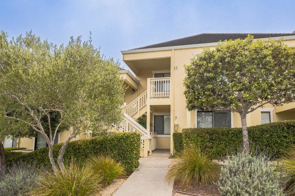 Welcome to this charming 757 sq ft condo in the picturesque city of Monterey, perfect for those seeking a cozy retreat. This residence offers 2 bedrooms and 1 bathroom with a shower over tub design. The kitchen is equipped with modern amenities including gorgeous granite countertops, a dishwasher & electric cooktop with double ovens, and refrigerator, seamlessly connecting to the living room, ideal for casual gatherings. BBQ and watch the sun set from the balcony with a view of the ocean. Flooring throughout the home consists of carpet and tile, providing comfort and style. Bathroom sparkles with beautiful granite countertops and double sinks. The home includes inside laundry with a stackable washer and dryer for your convenience. Energy-efficient features such as double pane windows and low flow toilets enhance sustainability. Located within the Monterey Peninsula Unified School District. Just a stroll down to Cannery Row with all of its fun shopping and top-rated restaurants. Embrace the Monterey lifestyle in this delightful home!