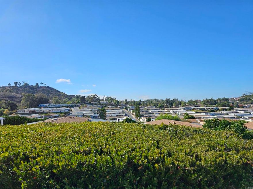 VIEWS and OCEAN BREEZES for days...every day!! ...If you purchase this  home WITH LAND - 2 bdrm/Bonus Sunroom/2 bath in 55+ Casitas Del Amigos. Newer stainless steel appliances and flooring. Great community with tons of amenities - including pickleball, sparkling pool, clubhouse, card and billiard room, fitness center, along with RV/Boat parking available. Brand new roof and westerly picture windows. Close to EVERYTHING. Come on in...it won't disappoint!