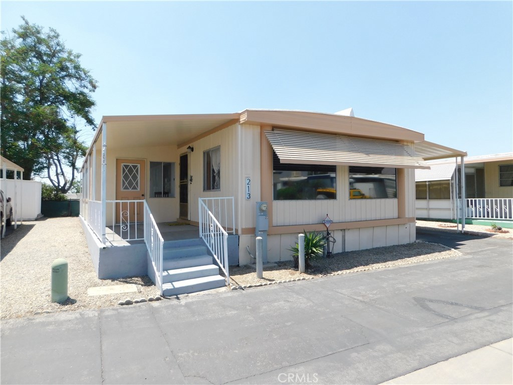 ~GREAT HOME SITUATED ALONG THE BACK PERIMETER OF THE PARK, LOCATED IN YUCAIPA'S HIGHLY REQUESTED 55+ COMMUNITY OF CRESTVIEW MOBILE ESTATES...LOW SPACE RENT ONLY $389~UPGRADES IN 2024 INCLUDE...ROOF RESEALED, FRESHLY PAINTED EXTERIOR, PAINTED INTERIOR, WATERPROOF VINYL FLOORING THROUGHOUT PLUS EVAPORATIVE COOLER WAS REBUILT~HUGE BRIGHT LIVING ROOM~FULL SIZE DINING ROOM WITH BUILT-IN HUTCH~SPACIOUS KITCHEN WITH PANTRY, NEW LED LIGHTING...FRIDGE INCLUDED~LAUNDRY HOOK-UPS IN KITCHEN~PRIMARY BEDROOM IS KING SIZE WITH WALK-IN CLOSET~PRIMARY BATH HAS WALK-IN SHOWER WITH ENCLOSURE~GUEST BEDROOM IS FULL SIZE~GUEST BATH HAS A TUB~LARGE CALIFORNIA ROOM~INVITING CONCRETE FRONT PORCH~PERFECT SIZE LOW MAINTENANCE YARD~SHED~***CALL FOR A TOUR***