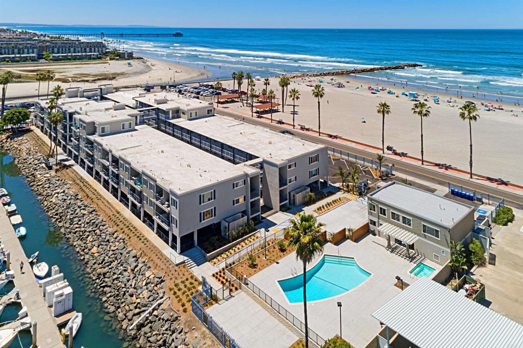 Opportunity to own WATERFRONT! This Complex sits uniquely in the peninsula where the ocean is on one side and the harbor on the other side. Where the beach and water activities are at your fingertips. Just steps away is fishing tours, boat rentals, paddle board & kayak rentals and a number of great restaurants and shops. Just a short walk south is the pier and downtown Oceanside where you'll find even more variety of restaurants, coffee shops, wine bars, cocktails, shopping and much more! Oceanside has rapidly become a great vacation destination! This unit was recently remodeled and comes fully furnished and move-in ready! Colorful harbor views with the gentle sounds of ocean best describes the vibe once you arrive. Unique to ONLY 6 bottom units in this complex is over 100 SQUARE FEET of PRIVATE PATIO space! SHORT TERM RENTALS OK! This gated community offers a pool, spa, BBQs and recreation center.
