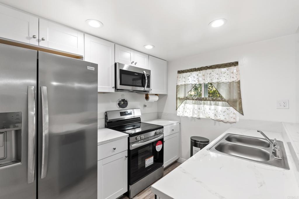 Welcome home to this fully remodeled bright and inviting 2-bedroom, 1-bathroom condo Featuring a rare attached garage for your convenience. Perfectly designed for comfort and functionality, this home offers a welcoming layout with an open living and dinning area, ideal for relaxing or entertaining guest.
