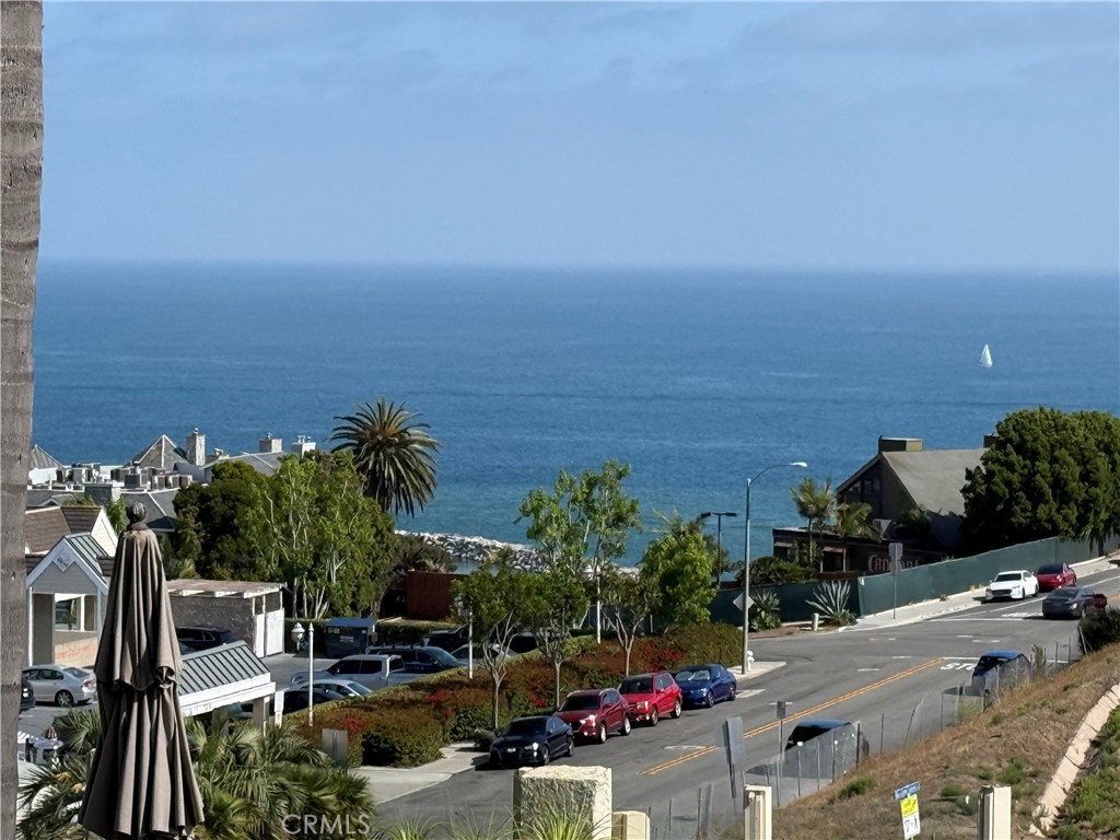 Spectacular ocean views. Huge backyard. One of the biggest lots and backyard in the whole tract. NEW! NEW! NEW! Remodel just completed. The following items are new: kitchen cabinets, quartz counter tops, vinyl plank flooring, dishwasher, high end 36" Thor range, microwave, faucets, light fixtures, new paint inside and out, glass stair railing, full opening glass doors leading from the primary bedroom to the ocean view balcony, remodeled bathrooms, Glass stair railing etc. etc.
The home currently shows as a 2 bedroom plus a gym. The balcony will be torn down and rebuilt the same size it is now which except at the right-hand corner there will be a 3ft-by-3ft diagonal piece removed. The new balcony will have frameless glass railing and will be completed prior to close. 2 full master bedrooms. Central Air. Shows like a model. The home is love at first sight! Located in the prestigious gated Regatta community. This stunning home offers a luxurious coastal lifestyle with all the amenities that will quickly make it your home. The home features a bright, open living space that seamlessly blends modern design with a warm and inviting ambiance. A spacious living room features a cozy fireplace, island and large windows showcasing panoramic ocean views.
The household gourmet will love the chef's kitchen and entertaining in the adjacent dining room while enjoying a great meal all the time, being spoiled by a spectacular ocean view which you will never grow tired of. It is the perfect ending to a long day. dining while admiring the coastal scenery. The Regatta community offers a resort-style pool, spa, and access to nearby walking trails. Located just moments away from Dana Point Harbor, renowned beaches, and world-class dining and shopping options, this home offers the epitome of Southern California coastal living.