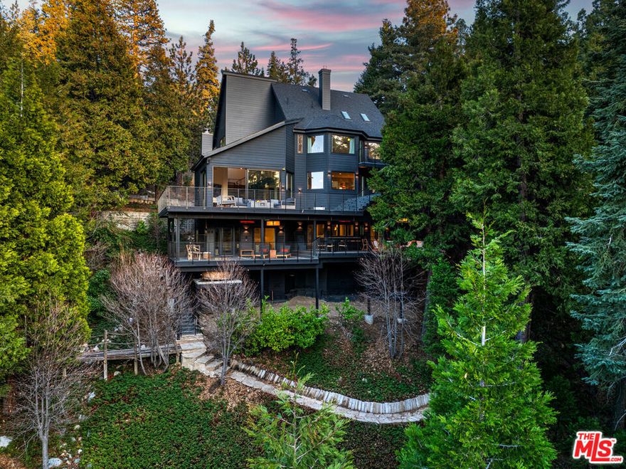 Nestled in the prestigious Arrowhead Woods Community within the exclusive Cedar Ridge Estates, this stunning 5-bedroom, 5-bath Danish Modern Chalet redefines mountain luxury. With expansive, breathtaking lake views, this 4,448 sq. ft. masterpiece sits on 5.43 acres, offering unparalleled privacy and tranquility.Lake Rights included, giving you access to dock ownership and all the amenities Lake Arrowhead has to offer! Recently transformed through an extensive renovation, this home has been updated from a classic lodge to a modern retreat. Highlights include a brand-new chef's kitchen, sleek new flooring, spa-like bathrooms, and spacious new decks designed to showcase the panoramic views.Designed to feel like your private mountain spa retreat, the property boasts your own hiking trails, a cedar hot tub, large sauna, cold plunge, firepits, fireplaces, steam shower, and a heated driveway for year-round convenience. Relax with cutting-edge technology, including a fully automated Control 4 home system, and take comfort in the Frontline Sprinkler Foam Retardant System for fire safety and peace of mind.All this, just 1 hour and 30 minutes from Los Angeles. Don't miss this one-of-a-kind retreatschedule your private tour today and experience the pinnacle of Lake Arrowhead living!