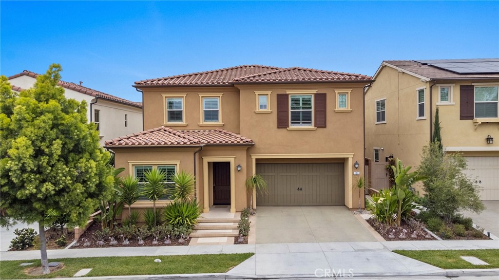 Welcome to your dream home in the highly sought-after Eastwood community of Irvine! This exceptional single-family residence offers 4 spacious bedrooms and 4 full bathrooms, seamlessly blending elegance, comfort, and modern convenience to set a new standard for sophisticated living. Step inside and experience a perfect balance of indoor and outdoor harmony. The first floor features a desirable open-concept layout with a bright living room, dining area, and gourmet kitchen—alongside a full bedroom and bathroom ideal for guests or multigenerational living. The chef’s kitchen is equipped with top-of-the-line appliances, luxurious countertops, and a large center island, making it the heart of the home. Abundant natural light fills the generous living spaces, creating a warm and inviting ambiance throughout. Upstairs, you’ll find three additional bedrooms, including a beautifully appointed primary suite. This home is loaded with premium upgrades and thoughtful details, including designer light fixtures, a smart home system, security alarm including backyard sliding door, built-in sound system, paid-off FULL solar panels, Hunter Douglas motorized shade at the backyard sliding door, plantation shutters and etc., luxury SPC flooring throughout, custom cabinetry in the walk-in closet and garage, and epoxy-coated garage flooring. Additional features include backyard wall decor, a European-made screen door, a state-of-the-art LG washer and dryer, and a built-in KitchenAid refrigerator valued at $12,000. The beautifully landscaped front yard and thoughtfully designed backyard offer the perfect outdoor spaces for relaxation and entertaining—ideal for enjoying California’s year-round sunshine. Located within the award-winning Irvine Unified School District and just minutes from grocery stores, dining, shopping centers, and major freeways, this home also grants access to resort-style community amenities including a sparkling pool, playgrounds, and sports courts—offering endless opportunities for family fun. This is more than just a home—it’s a lifestyle. Don’t miss your chance to make this exceptional property yours and experience the best of Southern California living!