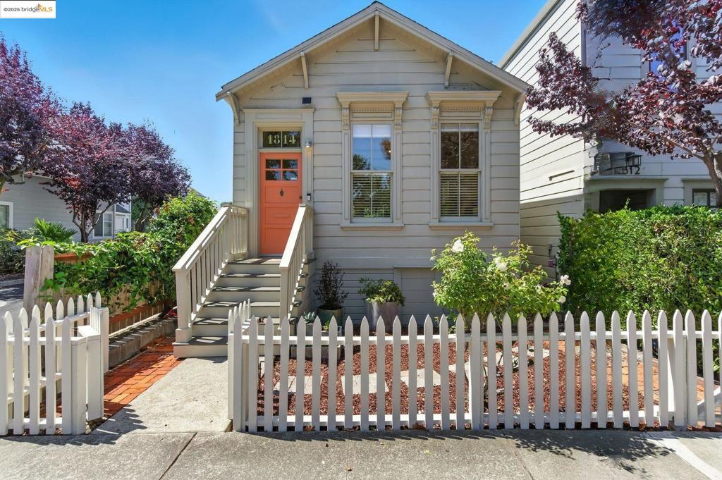 Step into a rare piece of Berkeley history with the Joseph Alphonso House, a preserved Workman’s Cottage built circa 1878 and designated a city landmark in 1992. Compact in scale yet accented with Victorian detail, these homes were built for artisans and tradespeople; today, few remain, making this a cherished link to the city’s past. This one-bedroom, one-bath residence offers 704 sq ft on a 3,113 sq ft lot, raised above the street to guard against flooding. Inside, it lives larger than its footprint suggests, with a sleeping loft, custom office nook, and smart storage including pop-out shelves, and a built-in armoire. Over $170,000 in upgrades blend historic character with modern comfort. A full foundation replacement with seismic strengthening and new windows provide security, while a renovated kitchen showcases a BlueStar range, Miele hood, Kohler sink, Hansgrohe faucet, and Neolith countertops. Additional updates include smart lighting, landscaping, fresh paint, and millwork. Outdoors, a picket-fenced front garden welcomes, while the private backyard offers irrigated beds, a fig tree, lawn, shed studio, and basement storage. Minutes from Fourth Street, the Gilman District, and transit, this is a rare chance to own a Berkeley landmark.