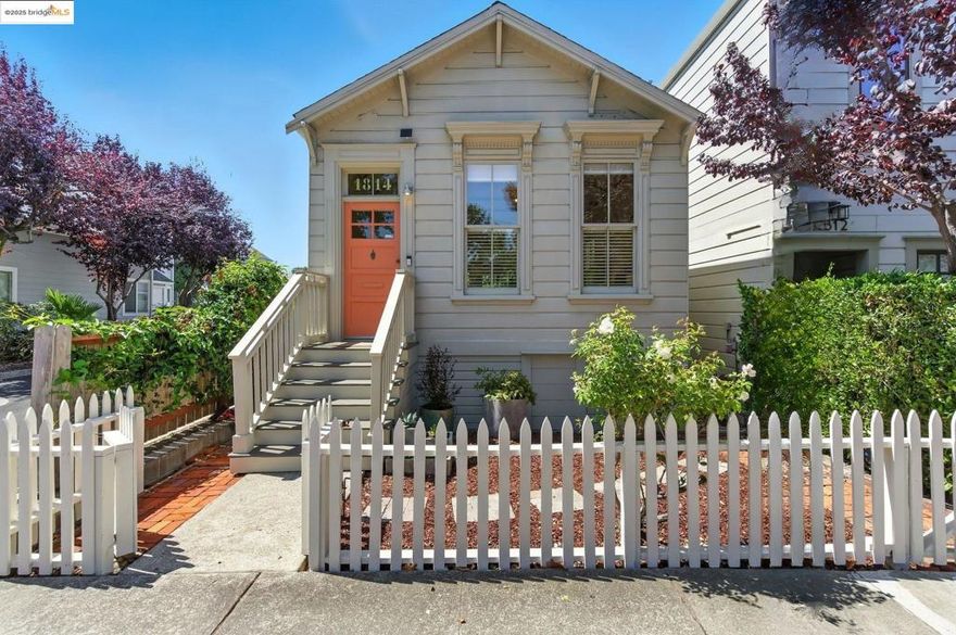Step into a rare piece of Berkeley history with the Joseph Alphonso House, a preserved Workman’s Cottage built circa 1878 and designated a city landmark in 1992. Compact in scale yet accented with Victorian detail, these homes were built for artisans and tradespeople; today, few remain, making this a cherished link to the city’s past. This one-bedroom, one-bath residence offers 704 sq ft on a 3,113 sq ft lot, raised above the street to guard against flooding. Inside, it lives larger than its footprint suggests, with a sleeping loft, custom office nook, and smart storage including pop-out shelves, and a built-in armoire. Over $170,000 in upgrades blend historic character with modern comfort. A full foundation replacement with seismic strengthening and new windows provide security, while a renovated kitchen showcases a BlueStar range, Miele hood, Kohler sink, Hansgrohe faucet, and Neolith countertops. Additional updates include smart lighting, landscaping, fresh paint, and millwork. Outdoors, a picket-fenced front garden welcomes, while the private backyard offers irrigated beds, a fig tree, lawn, shed studio, and basement storage. Minutes from Fourth Street, the Gilman District, and transit, this is a rare chance to own a Berkeley landmark.