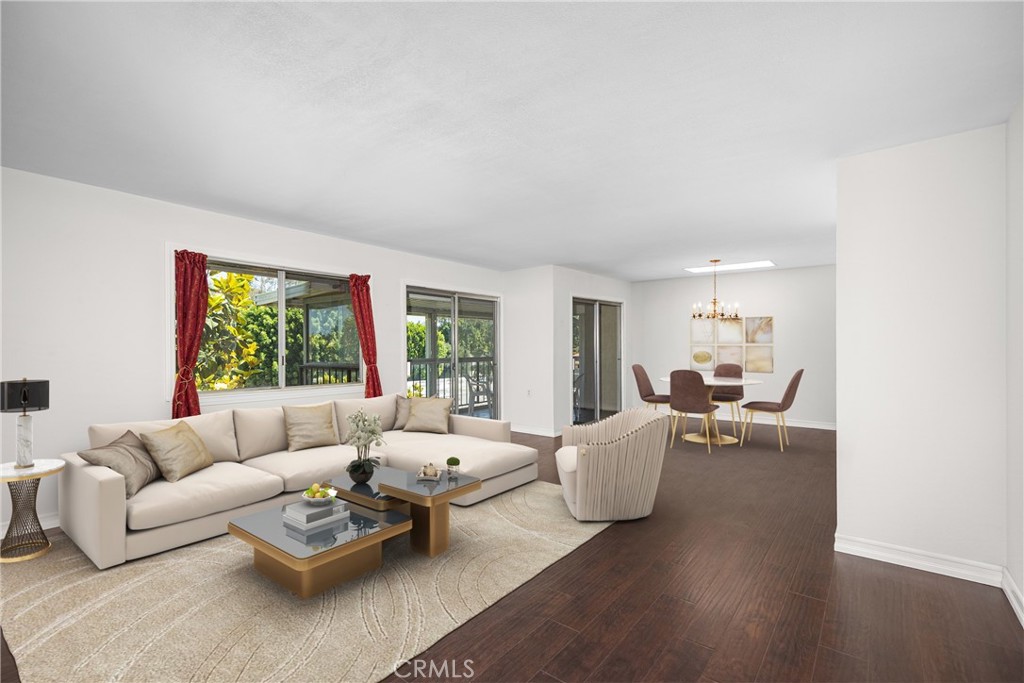Top-Floor “Penthouse” Living in Laguna Woods Village — 2369 Via Mariposa. Welcome to your serene third-floor retreat in the heart of Laguna Woods Village, Southern California’s premier 55+ community. This spacious and light-filled 1-bedroom, 1-bath condo offers an elevated, resort-style lifestyle with lush treetop views, beautiful natural light, and no stairs required, thanks to convenient elevator access. Step inside to discover nearly 1,000 square feet of single-level living with hardwood floors throughout, custom built-in shelving, and crown molding that adds a refined touch. Four skylights flood the space with sunshine, and a private screened entry offers peaceful airflow and an additional sense of security and comfort. The kitchen features Whirlpool appliances, tile countertops, and a clean, functional layout—ideal for daily living or hosting. The large bedroom includes hardwood flooring and ample closet space, while the bathroom features a tile floor and is adjacent to the home’s main living areas for added ease. Enjoy the convenience of garage parking with private storage and direct elevator access from the garage to your top-floor home. The home also features a smooth-finish ceiling, a valuable and time-consuming upgrade that not only enhances the look and feel of the space but also eliminates the original popcorn ceiling—a common feature in many other units. A laundry room just steps away on the same floor. The building is surrounded by mature landscaping and tranquil walking paths. As a resident of Laguna Woods Village, you’ll have access to an unmatched array of amenities, including: Two championship golf courses; Five swimming pools and four hot tubs; Ten tennis courts and seven pickleball courts; Three state-of-the-art fitness centers; An equestrian center; Seven clubhouses with hobby rooms, billiards, cards, ceramics, and more; Over 250 clubs and classes, including those offered by the Saddleback Emeritus Institute; Private restaurant & lounge, Performing Arts Center, Village Library, and even its own TV station; Transportation system, 24/7 security, and lush greenbelts with scenic walking trails. Whether you’re downsizing, investing in your lifestyle, or simply looking for peaceful living close to the beach, 2369 Via Mariposa delivers comfort, charm, and the full Southern California retirement experience.