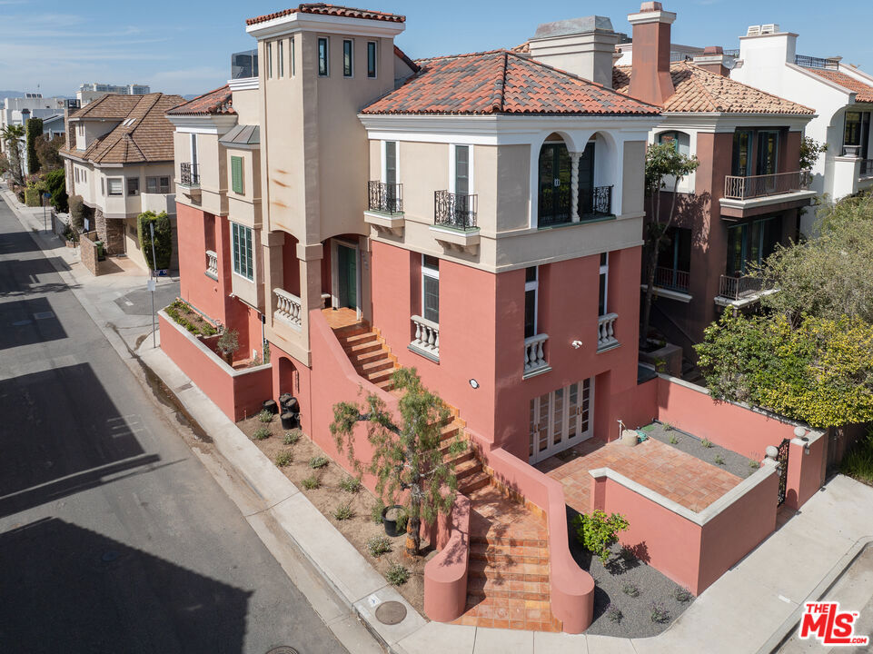 Welcome to this beautifully remodeled 4-bedroom, 3.5-bath Mediterranean-style home located in the Marina del Rey, just moments from scenic bike paths, the marina, and the sparkling Pacific Ocean. Spanning four thoughtfully designed levels and serviced by a private elevator, this residence offers a perfect blend of luxury, comfort, and coastal living. Step into the spacious living room featuring a cozy fireplace and rich hardwood floors. The formal dining room is ideal for entertaining, while the expansive kitchen has generous counter space perfect for culinary enthusiasts. Retreat to the primary suite with its own fireplace and a spa-like bath plus walk-in closet. Additional fireplaces in the family room and living area add warmth and charm throughout. Enjoy seamless indoor-outdoor living with a large private patio and a stunning rooftop deck offering panoramic views, ideal for sunsets and social gatherings. Additional features include a private 2-car garage plus an additional dedicated parking space, ample storage, and refined finishes throughout. With easy access to boating, the beach, and all the best the Marina has to offer, this exceptional home truly has it all. Also very close to restaurants, shops, freeways & LAX.