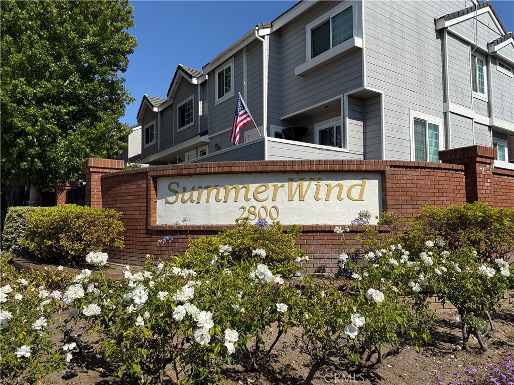 Welcome to this exceptional end unit in the prestigious gated community of SummerWind. This beautifully updated 3-bedroom residence showcases elegant wood flooring throughout, complemented by a gourmet kitchen featuring granite countertops and premium stainless-steel appliances. The bright and inviting living room offers a cozy fireplace and direct access to a private front patio. Modern upgrades include smooth ceilings with recessed lighting, central air conditioning, and vaulted ceilings in the bedrooms. The luxurious master suite boasts a walk-in closet and an en-suite bathroom with double vanity. A spacious downstairs laundry room comes complete with newer washer and dryer. Residents enjoy access to outstanding community amenities including three sparkling pools, spa, clubhouse, and children's playground, all within a secure gated environment with on-site management. Ideally located within walking distance to Wilson Park and minutes from Del Amo Fashion Center, this home offers convenient access to shopping, dining, and entertainment. Refrigerator, washer, and dryer are included. This is Torrance's most desirable communities, with HOA fees included in rent. Experience the perfect blend of luxury, comfort, and convenience in this meticulously maintained townhome.