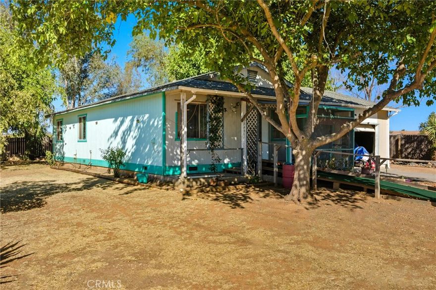Country Living on .62 acres with Tons of Potential! Dreaming of a mini homestead? Investment opportunity just 25 minutes from Chico! This 3-bed, 2-bath home has central heat and features a bonus converted garage that has both a private entrance and house access (perfect as a 4th bedroom, office, or flex space). Sitting on a spacious shaded 0.62-acre corner lot with mature fruit trees, a garden area, and multiple outbuildings. This property is ideal for 4-H or FFA families. Currently set up for animals with cross fencing, multiple access gates, water, and a sleeping/foul weather enclosure or you could add a shop, garage, or ADU. Well water, septic with recent vertical leach lines added and connected to PG&E natural gas. House offers solid bones ready for customization. This is a great chance to own land and create your ideal rural retreat. It won't last long!