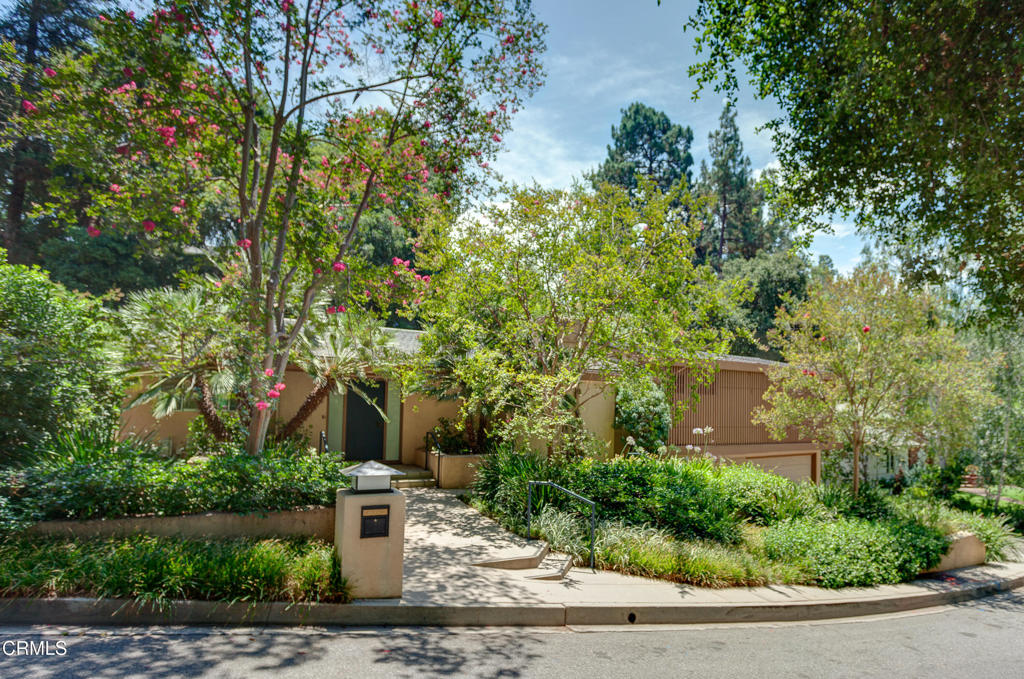 This absolutely stunning, mid-century modern home, located on a very special cul-de-sac in the historic Busch Garden Estate, creates a sense of tranquility and beauty upon entry. The lush and carefully landscaped backyard is perfectly framed with floor-to-ceiling glass within an open floor plan, providing a seamless transition between indoor and outdoor living. The chef's kitchen includes stainless steel appliances, granite counter tops, two sinks and dishwashers (one conveniently located adjacent to the built-in barbecue area outside), and streamlined custom cabinetry. Central to both downtown LA and all major freeways, this impeccably designed home creates a private, architectural retreat amid the vast metropolis.The upper level consists of a spacious master suite and bedroom, both of which open onto a private patio. The lower level has a third bedroom and en suite bathroom, leading to the laundry area and direct garage access. Note: Photos show staging furniture that is no longer in the property and lower level wine fridge in photos is now a washing machine.