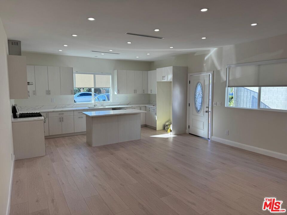 Introducing a brand-new two-bedroom, two-bathroom Accessory Dwelling Unit (ADU) available for lease in a quiet Van Nuys neighborhood. Offering approximately 1,000 square feet of living space, this residence features a newly updated kitchen, in-unit laundry, and a private entrance for enhanced privacy. Driveway parking is available for up to two vehicles. This unit provides a modern and comfortable living environment with convenient access to local amenities. Available for move-in on August 1st.