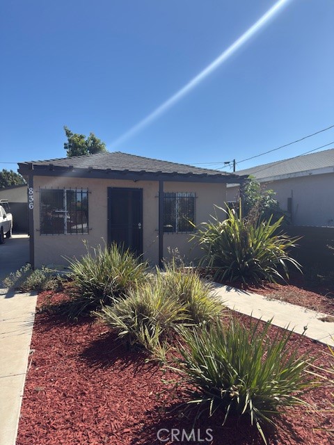 Lovely two-bedroom one bath home in the City of Compton, Recently painted, new laminate flooring in Living room and bedrooms, This home features an additional 400 Sft. Garage permitted, that can be converted into an ADU, plenty of space for family entertaining, parking for up to four cars. Must see to appreciate this home that is Move-in Ready, well kept and very nice landscaping