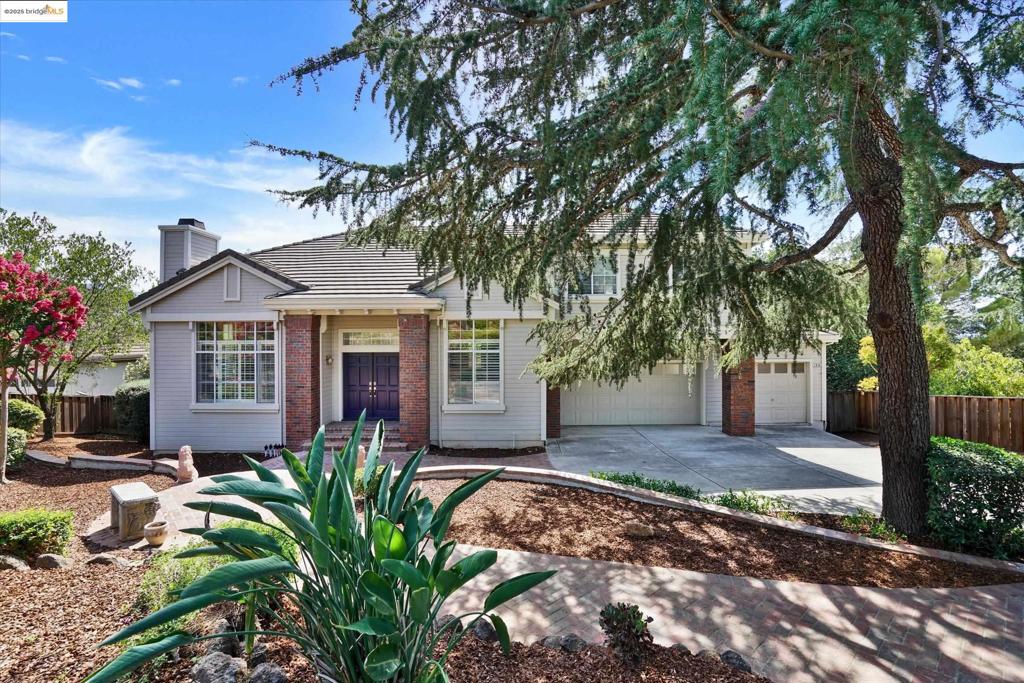 Spacious and private tri-level home with over a half acre and sweeping views! Refreshed and ready with new landscaping, fresh paints, all new flooring, updated bathrooms and more. Located at the end of a cul-de-sac and set back from the street and backing to a scenic back yard with views and a beautiful new balcony with unobstructed mountain views. Walk into the main entry and be greeted with a warm fireplace in the formal living room and a staircase leading to the formal dining area. A newly painted kitchen and lower floor family room with fireplace are ready for your entertainment! Entry level also offers a bed and bath for your guest or home office! Take the stairs leading up to a second family area, two bedrooms, and a large master suite with a private fireplace.. The additional family room could be used as-is or a children's play area, pool room or more. This home is move in ready and waiting for you to make it your own!. Open House on Sat. 9/20 1-4.