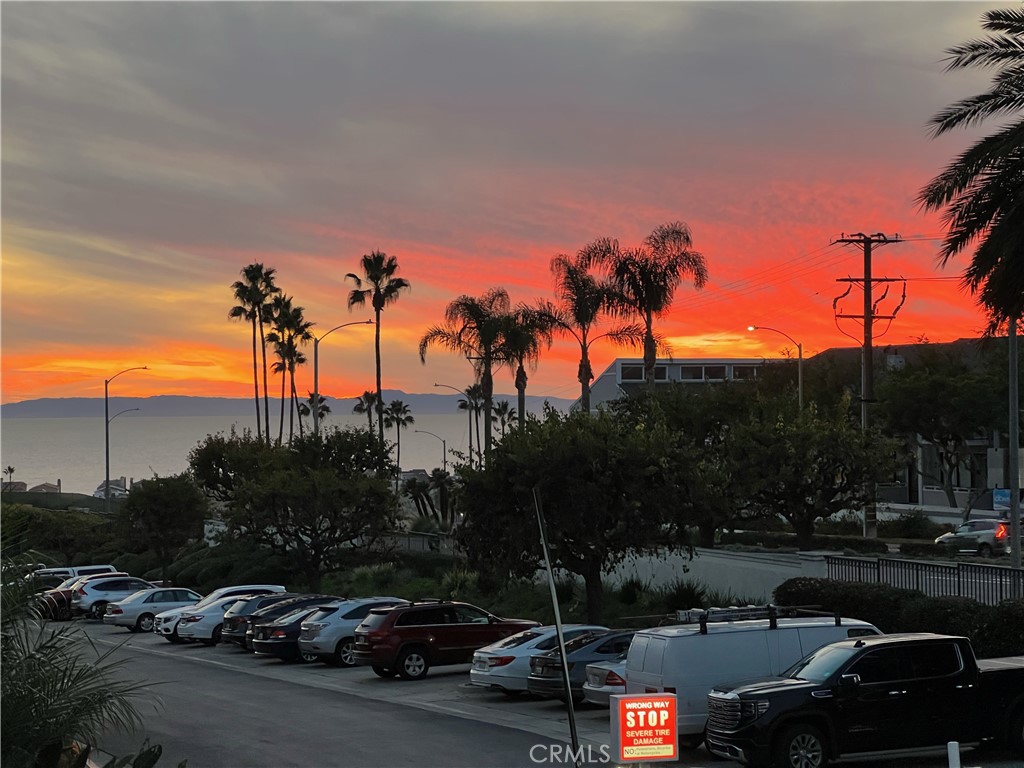 WOW! LOWEST PRICE CONDO IN VILLA BALBOA! Single level & entry level in this gate-guarded, secure coastal community. Such a location with ocean, Catalina and sunset views too! Wide open views, not looking into other units. Newer flooring, remodeled bathroom, remodeled kitchen with quartz countertops & newer appliances, dual paned windows, freshly painted and oh, so inviting with spacious floorplan flowing out to the view deck. Inside washer, dryer and walk-in closet. Enjoy coastal breezes along with the amazing resort-style amenities of beach living at Villa Balboa! Walking paths through the lushly planted grounds to your choice of these amenities; the clubhouse, 2 swimming pools, spa, gym, recreation room, barbq's, tennis & pickleball courts, a library, conference room, assigned space in lower level garage and a short stroll to Sunset View Park for walking, jogging or biking with benches, picnic tables, sometimes butterflies and spectacular ocean views! All this and near Lido Marina Village, Newport Beach Pier, the historic Dory Fishing Fleet Market, fine dining restaurants, outdoor cafes, boutique shopping, world-class shopping at Fashion Island and miles of sandy beaches, crashing waves and sparkling bays. BEST TO GET IN ON THIS ONE FIRST!