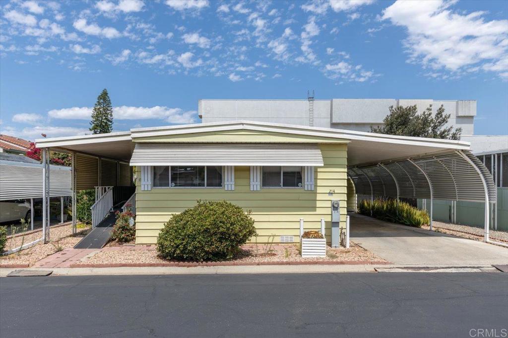 Affordable home located in a clean, 55+ community with rent control! Home does need some TLC and has been priced appropriately to make this a great opportunity for a handy person! No property taxes (Home is still on HCD registration). The private and shady backyard has many fruit trees, a storage shed, and no rear neighbors. Extra wide driveway with privacy panels. Covered porch. This home is more accessible with low rise steps and a ramp. The interior boasts walk in closets in both bedrooms. Home is conveniently located near community clubhouse w/ activities & amenities such as a pool, spa, gym, billiards room, library, etc. Walk to the nearby corner Bus Stop for easy transportation and only a 1/2 block to Vons, Ralphs, CVS. Carefree Ranch is a 55+ community that allows 2 pets on approval. Monthly space rent is $920.08.