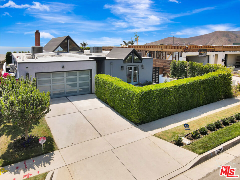 Modern Coastal Living in Sunset Mesa. This fully rebuilt 4BD/3BA home blends modern design with breathtaking ocean and mountain views. The expanded open layout showcases vaulted ceilings, custom plate glass windows, and a seamless connection to outdoor living. From the backyard and living spaces, enjoy stunning views that stretch across the coastline, including the iconic Ferris wheel at the Santa Monica Pier. Every detail reflects quality: an 8' Douglas Fir entry door, walnut cabinetry, California Closets, custom shades, and Porcelanosa-tiled bathrooms with TOTO fixtures. The chef's kitchen features Sub-Zero, Thermador, Walker Zanger stone, and a wine fridge, perfect for entertaining. A climate-controlled garage with mini-split perfect for a gym or art studio and integrated smart home technology complete the package. Located in Malibu's coveted Sunset Mesa community, just above the Getty Villa, you're minutes from Pacific Palisades, Santa Monica, and Malibu beaches, within the highly regarded SMMUSD district. Enjoy the rare combination of coastal tranquility, modern comfort, and convenience to city amenities. Neither seller nor Brokers/Agents guarantee the accuracy of allowable square footage, lot size, permits or other information concerning the property. Buyer is advised to independently verify the accuracy of all information through personally and with the appropriate professionals. Buyer is responsible for determining square footage of land, permits and lot lines. There are CC&R's in Sunset Mesa with ocean view protections.