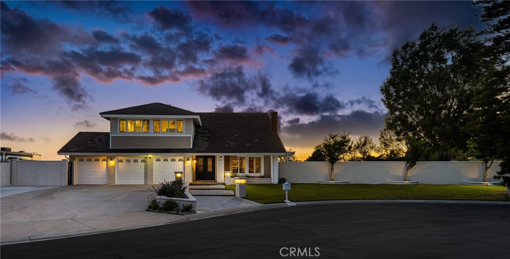 Welcome to 6021 Saddle Tree Lane | Yorba Linda, CA
Prepare to be captivated by unbelievable panoramic views that stretch all the way to the ocean on a clear day—and as the sun sets, enjoy the magical Disneyland fireworks lighting up the sky each night and the stunning city light views. This exceptional home offers a rare blend of luxury, comfort, and postcard-worthy scenery, all located in the prestigious Parkside Estates on a quiet cul-de-sac just around the corner from Yorba Linda Country Club. From the moment you arrive, this residence delivers elegance, comfort, and panoramic views that truly set it apart.
Step through custom wrought iron doors and into a refined living space filled with designer finishes and high-end craftsmanship throughout. This stunning home features 4 spacious bedrooms and 3 bathrooms, thoughtfully laid out to maximize both comfort and functionality.
The upscale kitchen is a chef’s dream, complete with luxurious solid walnut cabinetry, granite countertops, and top-of-the-line professional appliances. Whether you’re preparing everyday meals or entertaining guests, this kitchen is designed to impress.
Gather in the separate family room with a rock fireplace and custom built-in cabinetry—perfect for relaxing evenings at home. The adjacent living room boasts soaring vaulted ceilings, another striking rock fireplace, and a gorgeous custom bar—ideal for hosting and making memories.
Throughout the home, you’ll find handsome engineered white oak flooring, adding warmth and timeless style.
The primary suite is your personal retreat. Wake up to spectacular views and step out onto your private view deck to take in the scenery that stretches all the way to the ocean on clear days. The remodeled en-suite bathroom is a showstopper with luxurious finishes and a dream walk-in closet that feels like your own boutique.
The backyard is an entertainer’s paradise, featuring:
Expansive covered patio and seating area
Beautiful pool and spa
Five-hole putting green with two sand traps
Large grass lawn and garden beds
Refreshing afternoon breezes
Bonus features include a large built-in wine fridge, charming dining space off the kitchen, and a layout designed for both casual family life and upscale entertaining.
This is the perfect blend of luxury living and relaxed California lifestyle, all in one of Orange County’s most desirable neighborhoods.