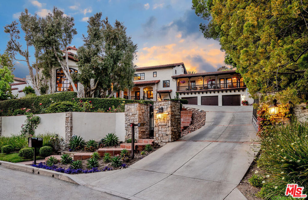 Welcome to paradise in the heart of the prestigious Pacific Palisades. Spanning an impressive 7,435 square feet, this magnificent Monterey colonial gated home boasts 7 elegant en suite bedrooms and 9 bathrooms that blend comfort with uncompromised luxury on a spacious 1/2 acre. All beds are conveniently located upstairs. Enter the gourmet kitchen with an 8-burner Viking range, double wall oven, warming drawer, SubZero fridge, 2 Miele dishwashers, and beautiful Jerusalem stone counters with a teak countertop on the center island. The sprawling 400 sq ft screened-in patio perfectly transitions from indoor to outdoor living, creating a harmonious blend between relaxation and entertainment.  The 3 fireplaces, beautiful stenciled wood beams, Malibu tile, and custom, hand-distressed Walnut floor throughout are additional features. The meticulously landscaped garden offers a delightful array of 10 varieties of fruit trees, mature palms, and vegetable and herb gardens for the green-thumb enthusiast, creating a sanctuary of nature and tranquility. The backyard's focal point is undoubtedly the pristine saltwater pool and spa, surrounded by a gorgeous patio. Entertaining is effortless with the fire pit, built-in BBQ, and an authentic pizza oven, ideal for hosting summer get-togethers. This home effortlessly exudes sophistication, luxury, and warmth. You will love all the storage in your 3-car garage. It is truly one-of-a-kind property and a remarkable place to call home.