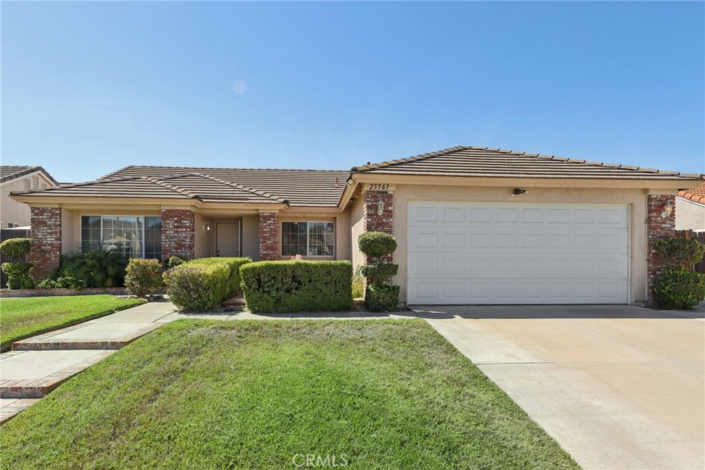 Welcome to 25561 Dorval Court, this charming Menifee home featuring 3 bedrooms, 2 bathrooms, and a 2-car garage with the added bonus of covered RV parking. The home offers excellent curb appeal with green grass, mature shrubs, and brick accents that beautifully complement the stucco and brick exterior. Inside, you are greeted by a spacious formal living and dining room with brand new carpet, perfect for entertaining. The family room, complete with a cozy brick fireplace, opens seamlessly to the kitchen, where you’ll find oak cabinets, white tile countertops, a center island, and stainless steel appliances. Each of the three bedrooms features wood laminate floors and ceiling fans, while the master suite boasts a walk-in closet, sliding glass door to the backyard, and an en-suite bathroom with dual sinks and a tiled shower with glass doors. The convenience of an indoor laundry room adds to the functionality of the home. Step outside to your private backyard retreat, complete with a full-length patio cover, sparkling pool and spa, multiple storage sheds, and lush mature landscaping. To top it off, the home is equipped with a 14-panel solar system and backup battery to help reduce energy costs. With low taxes, no HOA, and a perfect balance of comfort, efficiency, and outdoor enjoyment, this property is a must-see. (This home was originally a 4 bedroom and could easily be converted back if needed)