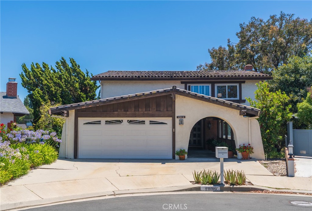 Tucked away on a quiet, tree-lined cul-de-sac in one of Rancho Palos Verdes’ most desirable neighborhoods, this charming Spanish-style home boasts 5 spacious bedrooms, 2.5 bathrooms, and approximately 2,494 square feet of living space. The house sits on a generous 7,951 sq ft lot, ideal for growing families or those who love to entertain. Step inside to discover a light-filled layout with multiple living areas, a formal dining room, and a functional kitchen awaiting your personal touch. Expansive windows invite in natural light while offering views of the lush landscaping and private backyard. The home’s classic design features include a wet bar, expansive balcony, and hardwood floors that honor its 1967 roots while offering potential for modern upgrades. The backyard provides a serene escape, with ample room for outdoor dining, gardening, or entertaining. With the attached garage and additional driveway capacity, there’s room for multiple vehicles. Located within the award-winning Palos Verdes Peninsula Unified School District, and just minutes from parks, hiking trails, shopping, dining and the coast, this property offers an unbeatable lifestyle in a tranquil, family-friendly community. Whether you're looking to move right in or update to your dream design, this home presents a rare opportunity to own a home in this coveted Palos Verdes enclave.