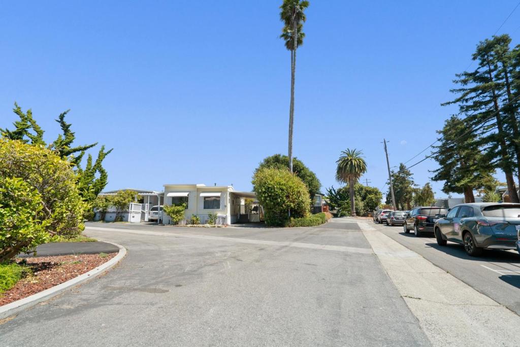 This Beauty by the Beach is the affordable home you've been waiting for! Located in one of the most desirable senior parks in Santa Cruz with rent control, this home really shines and it's ready for you to enjoy this slice of Heaven. Several updates include a new roof, plumbing, flooring, paint, updated bathroom, granite kitchen countertops, new back landscaping, front & back irrigation, 2 back sheds, etc....Some furniture included in the sale. End unit on the beach end of park with a short walk to the Cove beach & Santa Maria's huge dog friendly beach! Easy bike ride to the Yacht Harbor or Capitola. To live your life at the coast for this price and in this park is truly Amazing!!