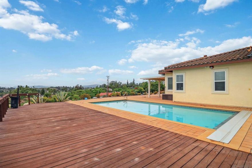 Stunning Single-Story Home | Panoramic Views | 3.69 Acres Beautifully maintained single-level home featuring 3BR + office/4th BR, 2.5 BA, open-concept layout with formal dining, family room, living room, and breakfast nook. High ceilings, ceiling fans in all rooms, Wood plantation window covering on all windows throughout the house,  whole-house generator, and large gourmet kitchen. Expansive outdoor living space includes solar-heated salt water pool with auto cover, 3-car garage, RV parking, and multiple fruit trees (including avocado). Situated on a private 3.69-acre lot with nearly 360° views. Move-in ready!  Welcome to your dream home—where modern comfort meets breathtaking views. This stunning single-story residence offers nearly 360-degree panoramic vistas that must be seen to be believed. Thoughtfully designed with both style and function in mind, the home features 3 spacious bedrooms, a dedicated office/gym that can easily serve as a 4th bedroom, 2.5 BA and high ceilings that create an open, airy atmosphere throughout.  The gourmet kitchen is perfect for the home chef, seamlessly connecting to the family room, living room, formal dining area, and a cozy breakfast nook—ideal for both entertaining and everyday living. All rooms are outfitted with high-quality ceiling fans and light fixtures for comfort and elegance.  Wood plantation shutters on all windows throughout the house.  window inserts for energy efficiency.  Outside, enjoy a large sparkling pool equipped with solar heating and an automatic cover, perfect for year-round enjoyment. The expansive 3.69-acre lot includes a variety of mature fruit trees—including multiple avocado trees—offering both beauty and bounty.  Additional highlights include:  A 3-car garage  Dedicated RV parking and ample space for recreational toys  Whole-house generator for peace of mind  Elegant foyer entrance that makes a lasting first impression  This home combines functionality, luxury, and natural beauty—offering a truly welcoming and versatile space to call your own.